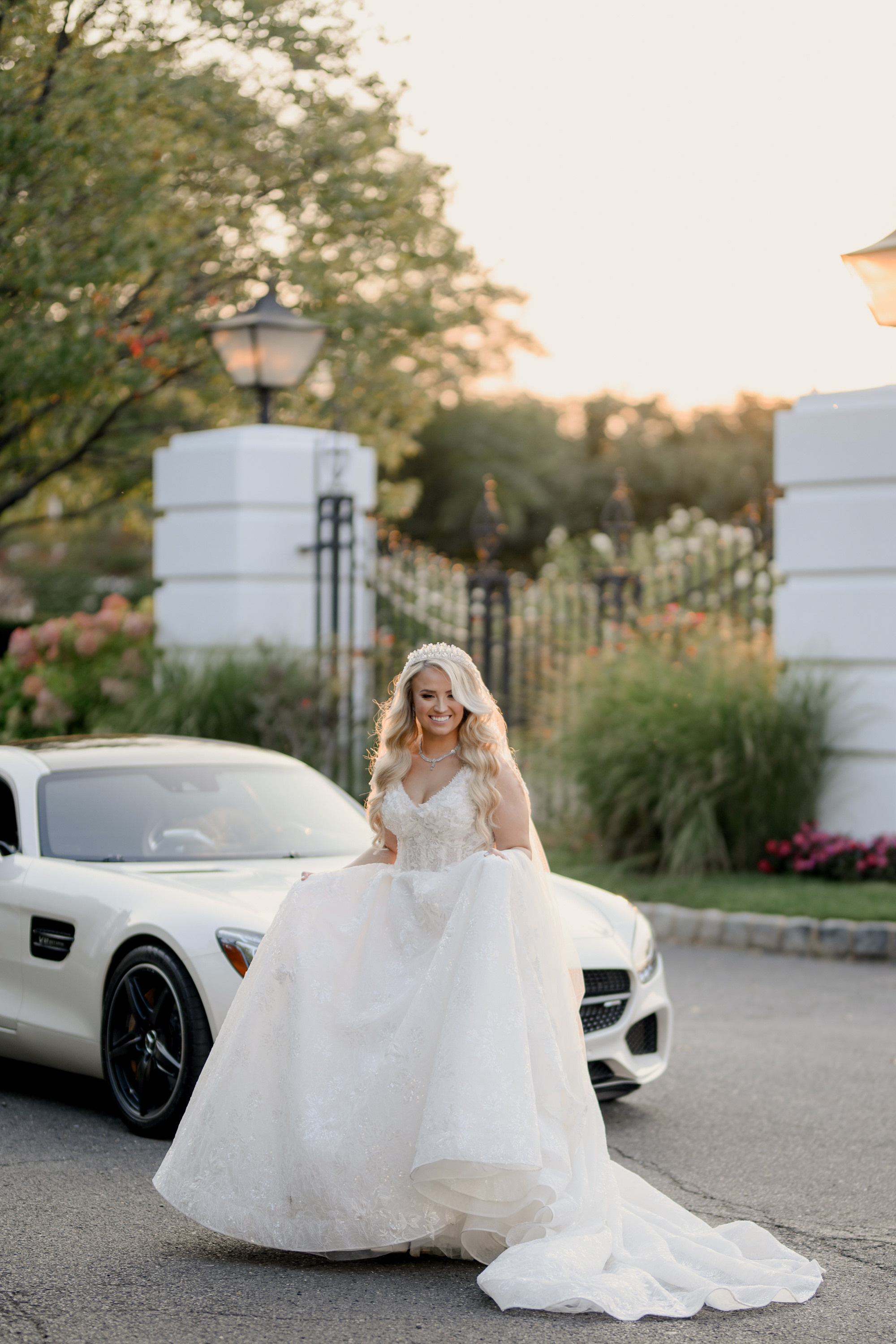 a bride in a white dress and a white car