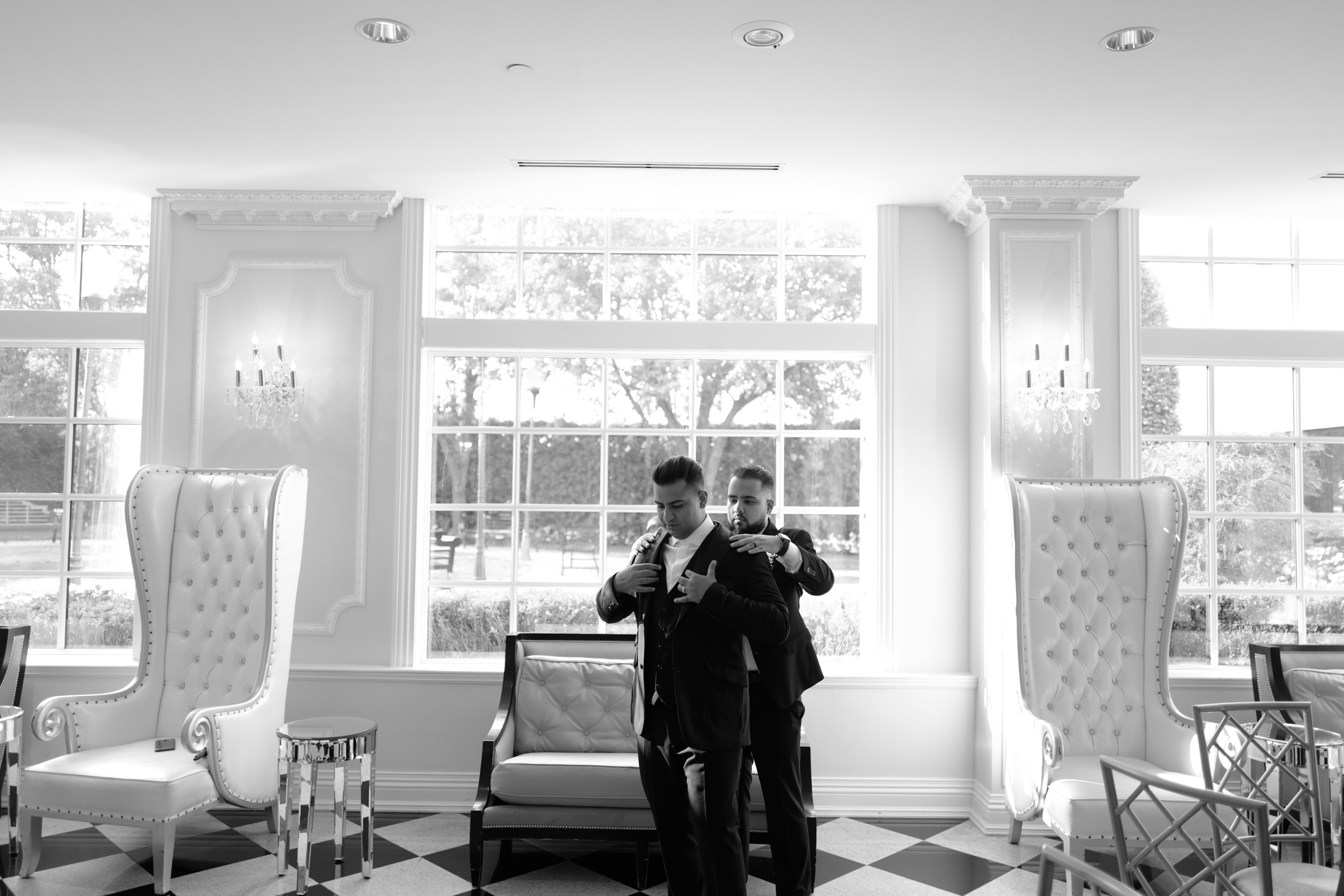 a man in a suit taking a picture of himself