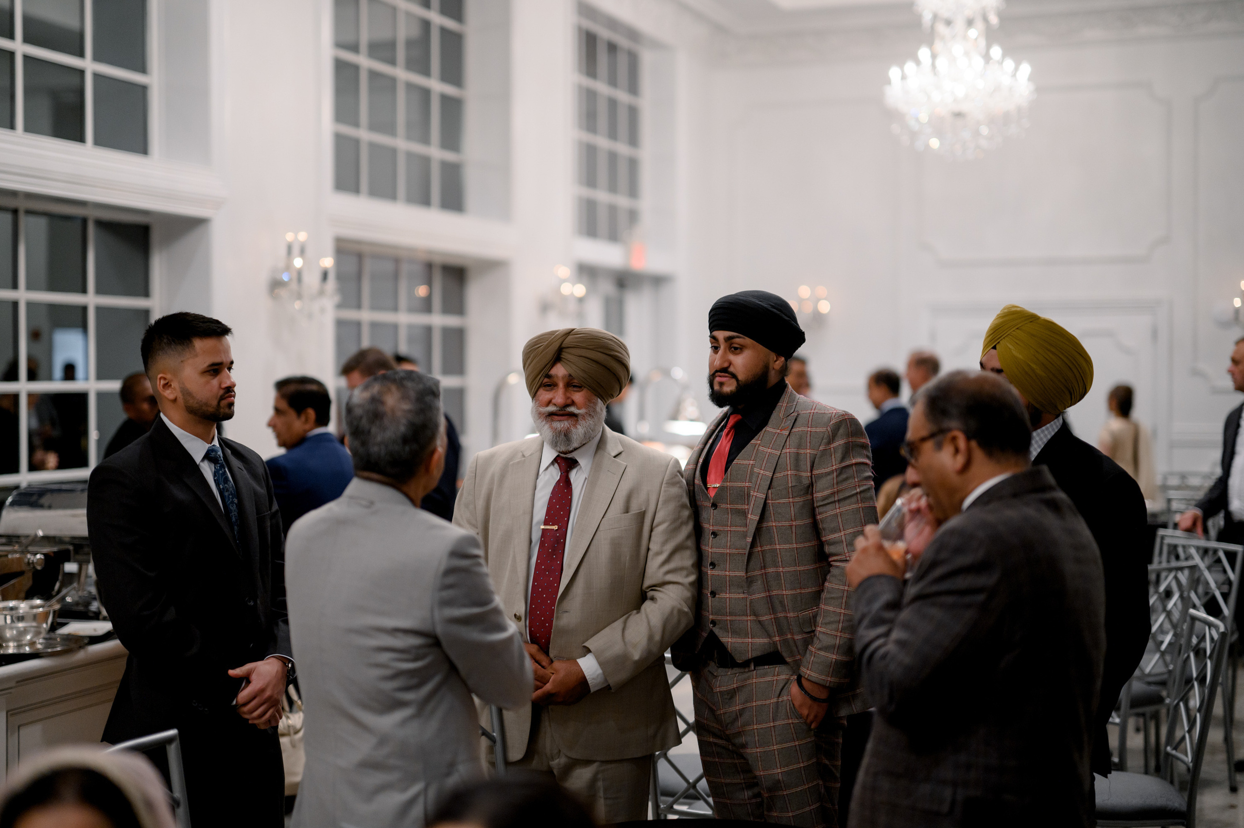 a group of people standing around a table