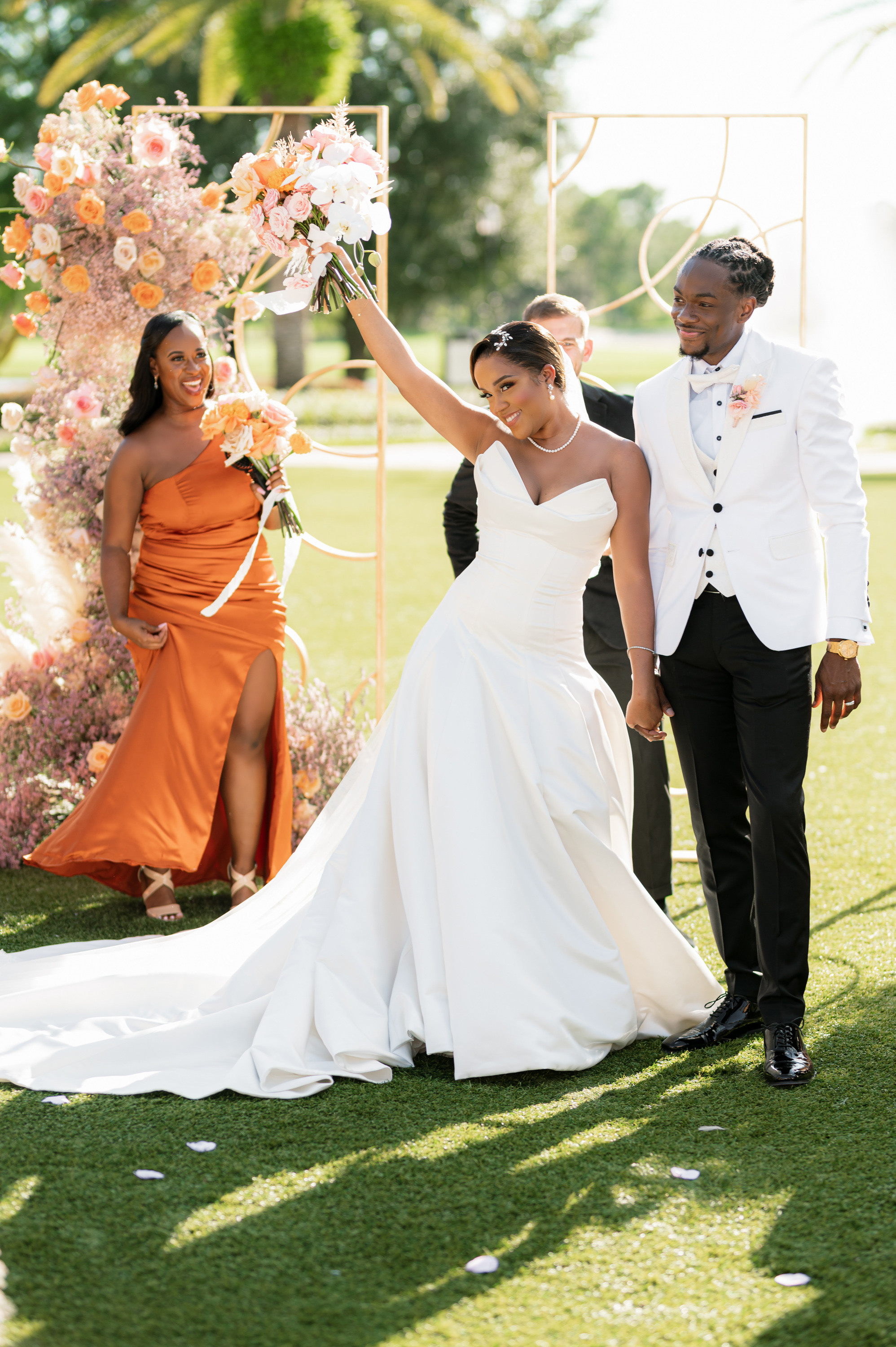 a bride and groom walking down the aisle