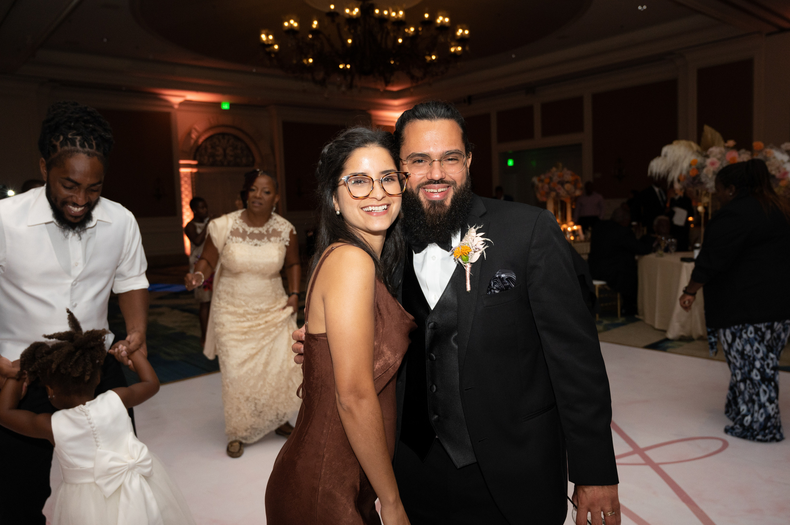 a man and woman are posing for a picture