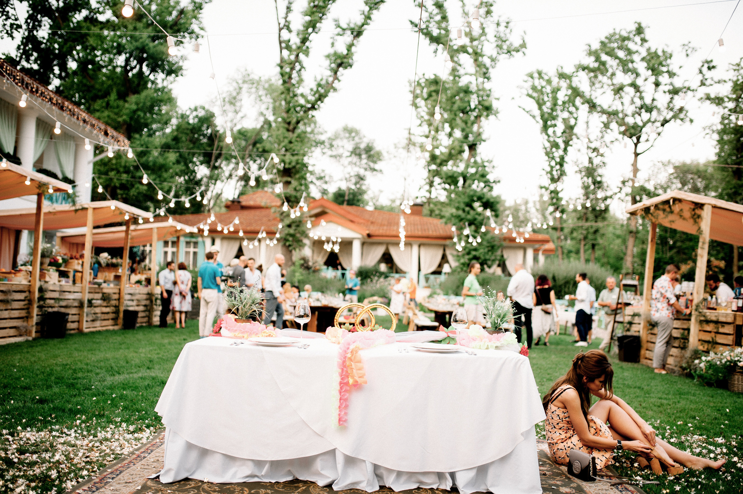 a couple sitting at a table with a cake
