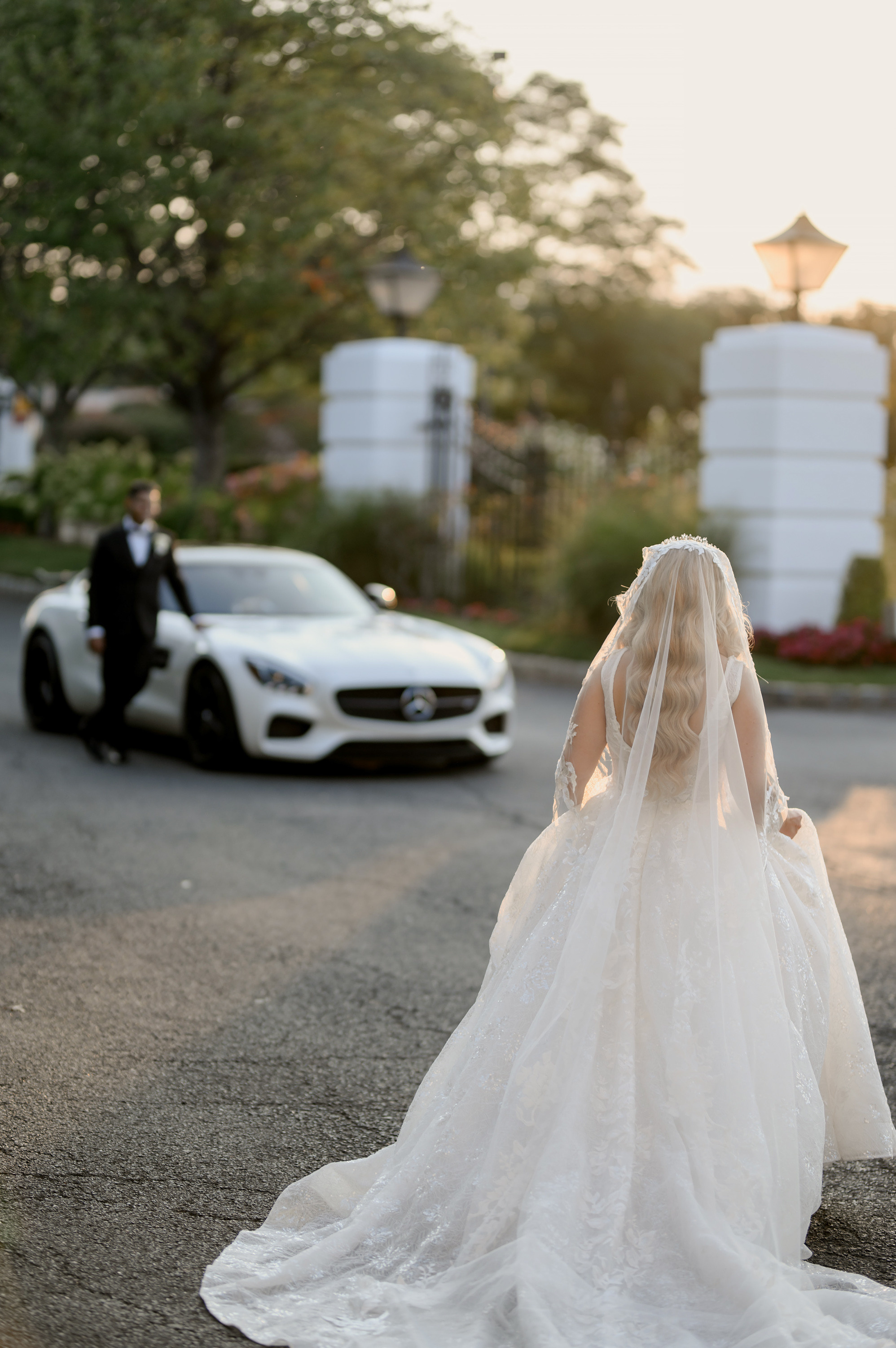 a bride in a wedding dress walking down the street