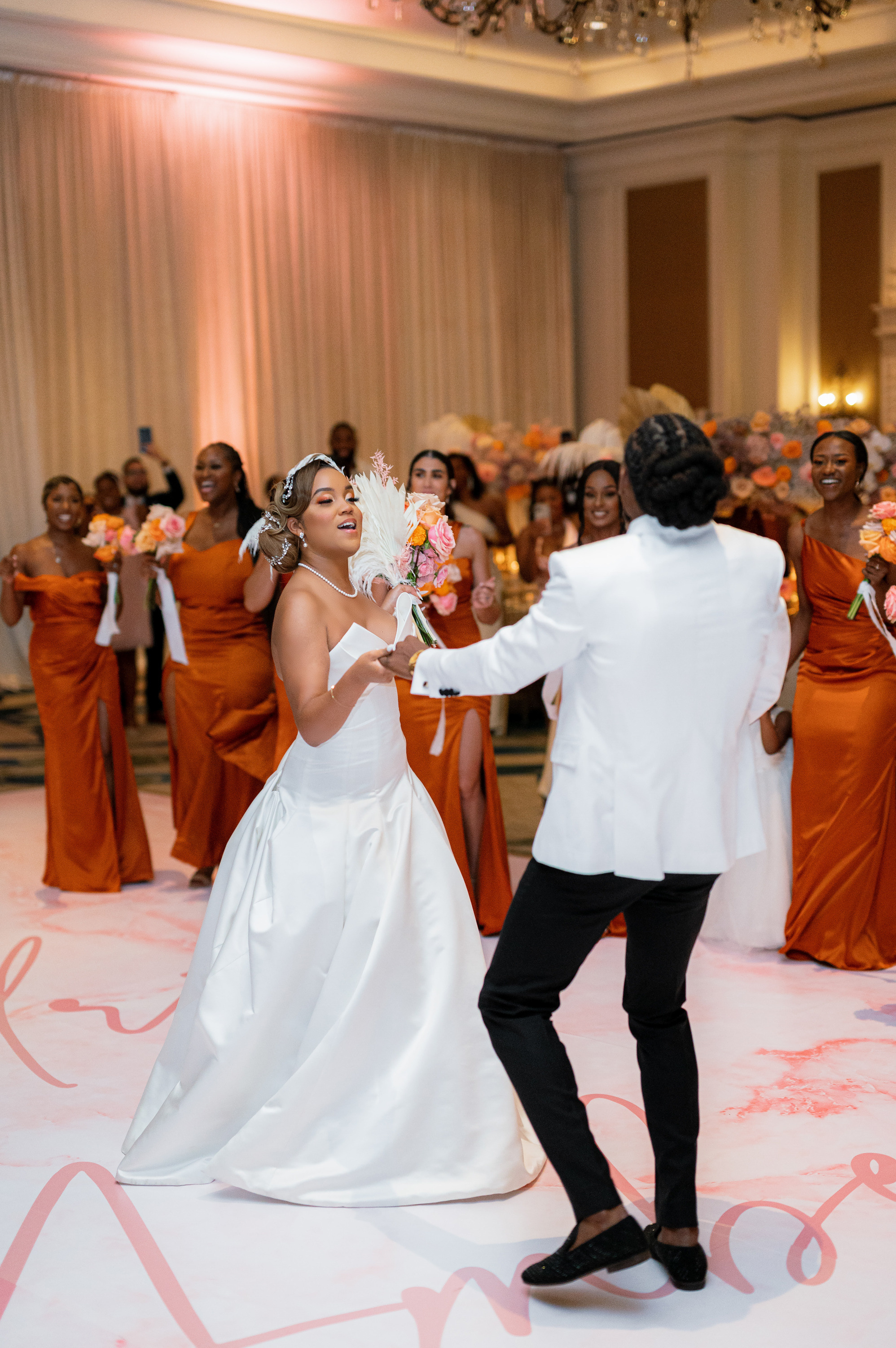 a bride and groom dancing on the dance floor