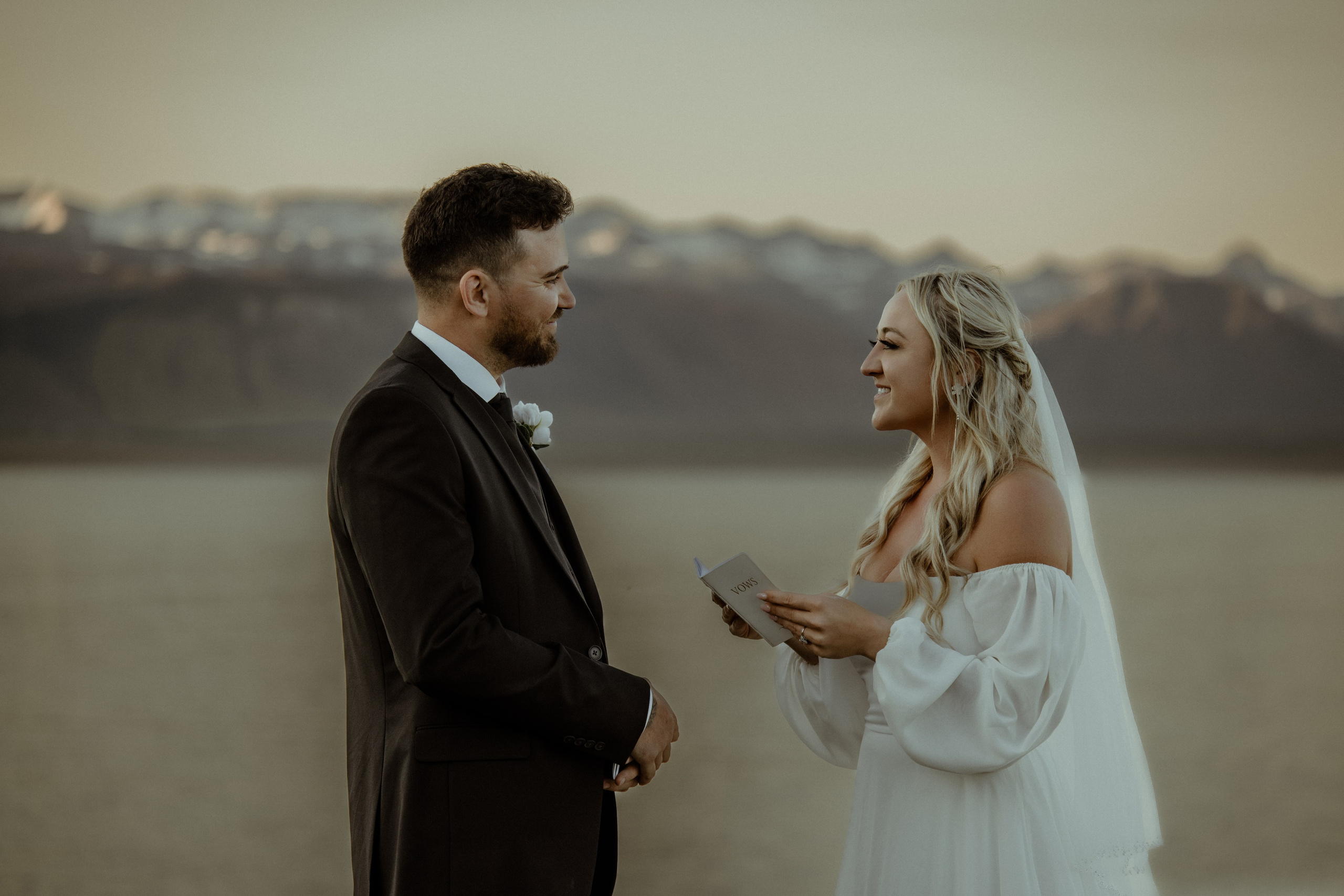 Iceland elopement at Budir with midnight sun wedding photos at black sand beach. Iceland elopement photographer & videographer