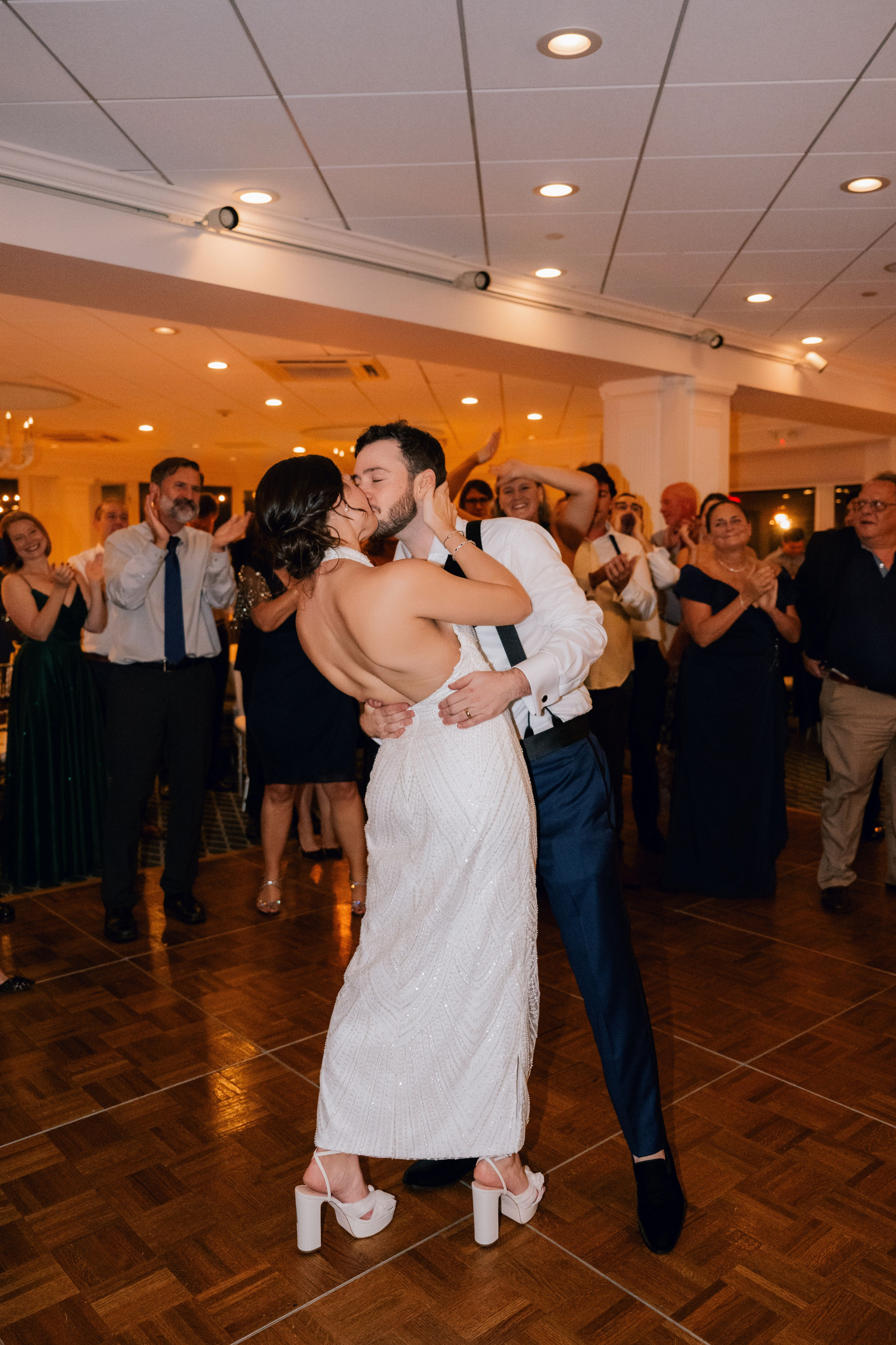 a bride and groom dance together at a wedding reception