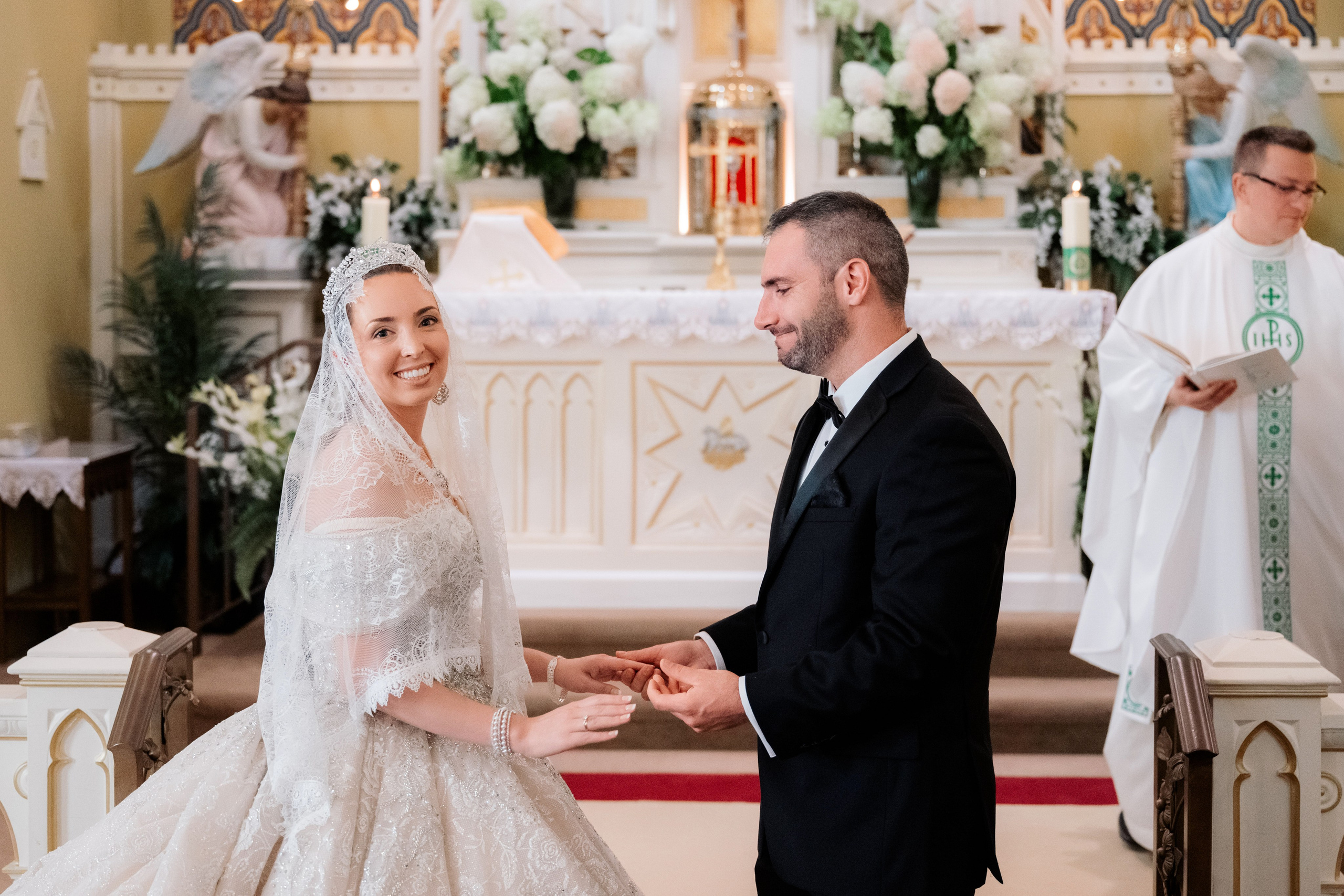 a bride and groom are sitting in a church