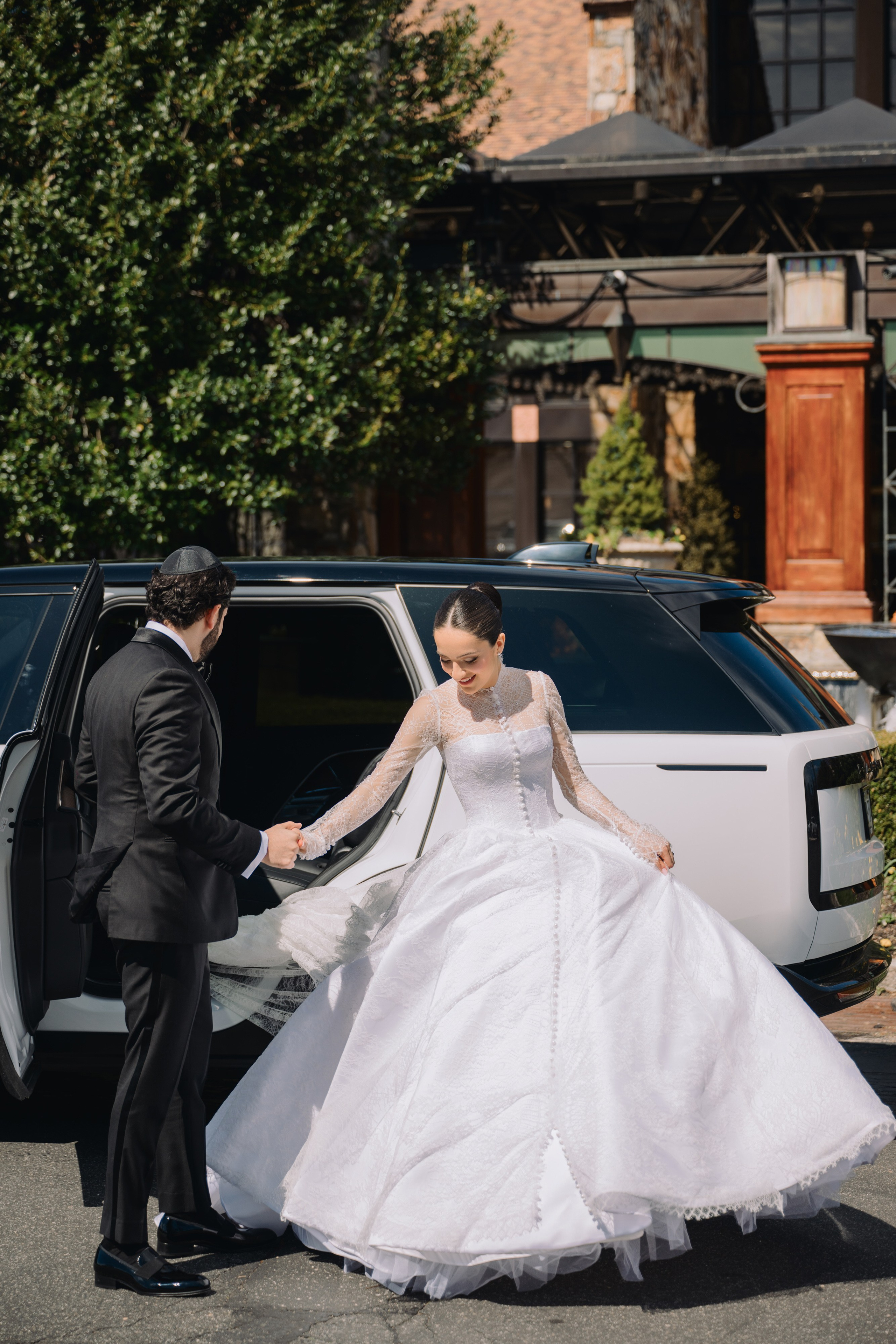 a bride getting into her car