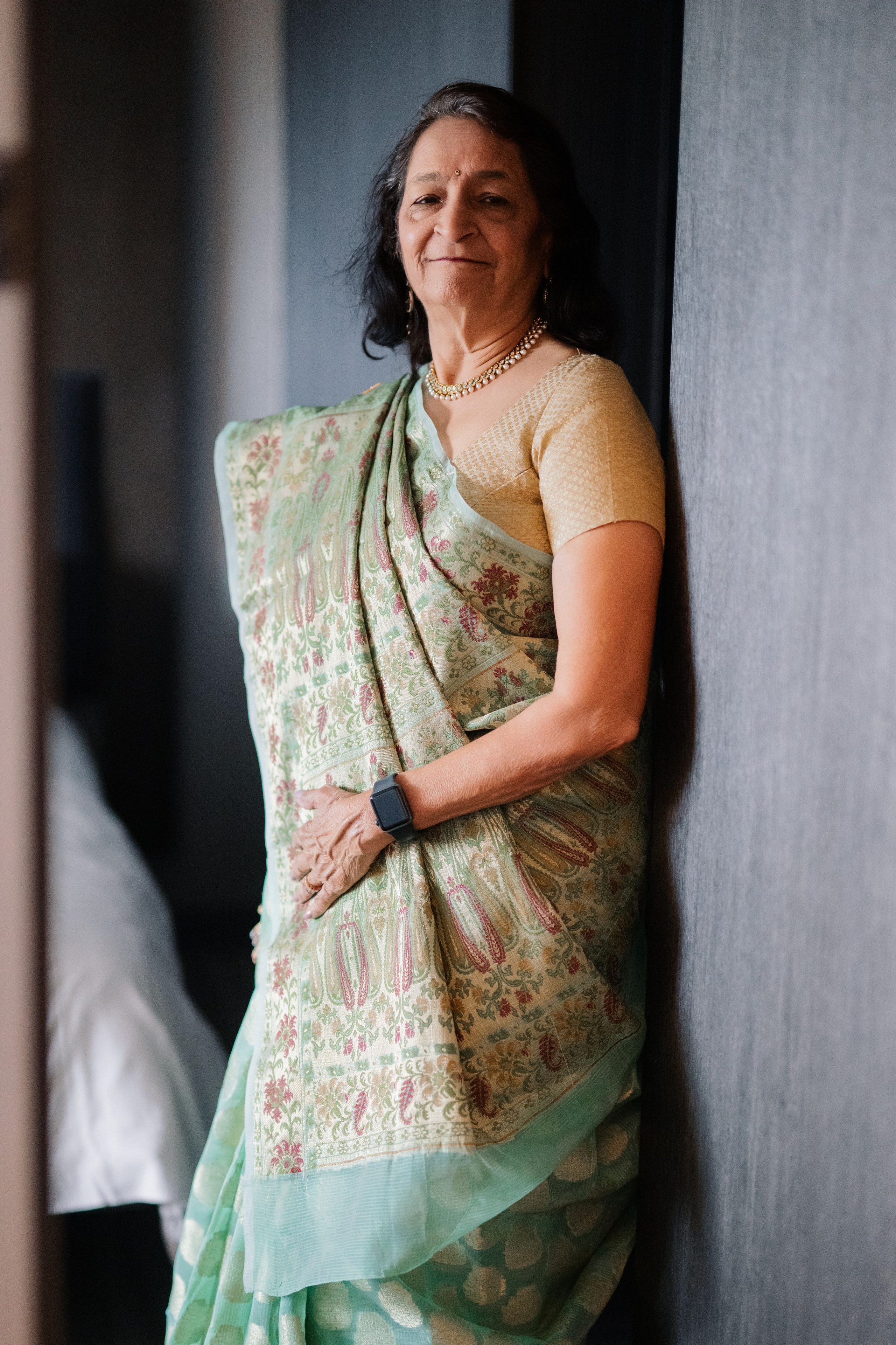 a woman in a green sari