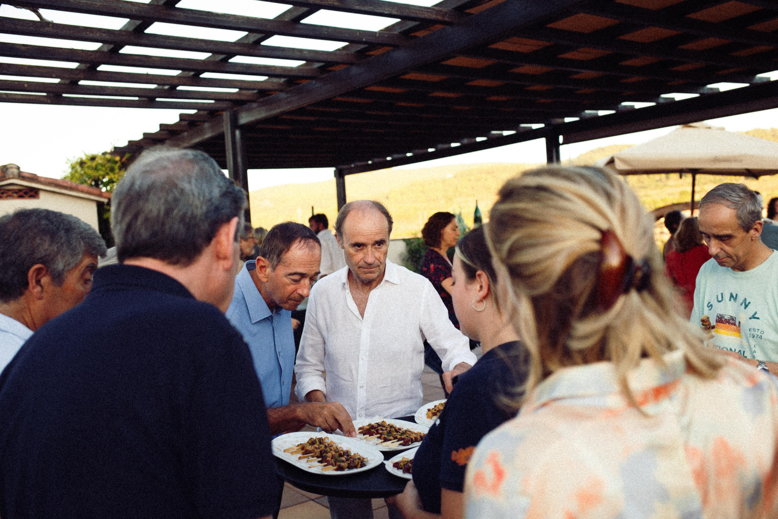 Guest picking a canapé from a tray at an event