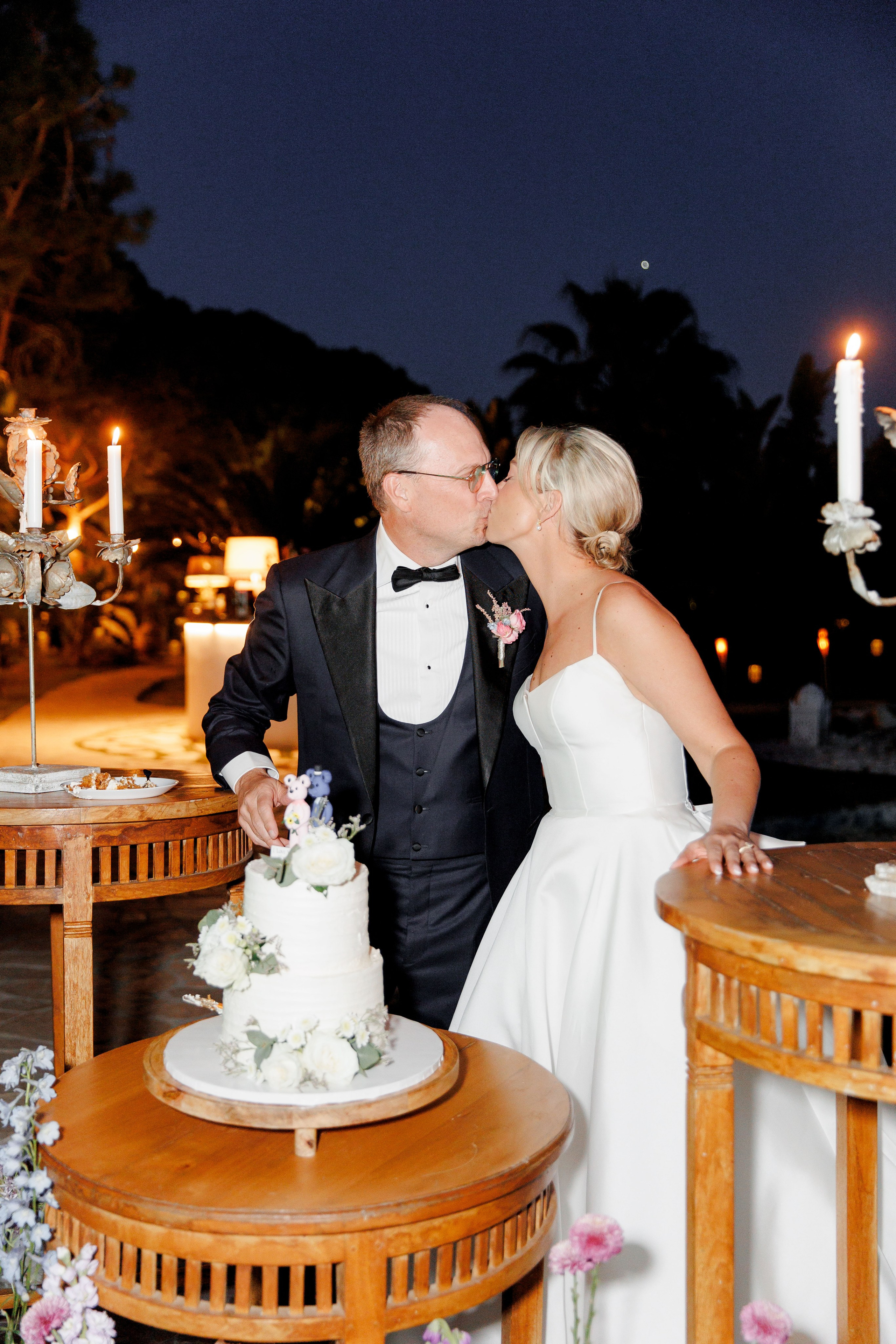 Couple is cutting the cake during a destination wedding in Barcelona