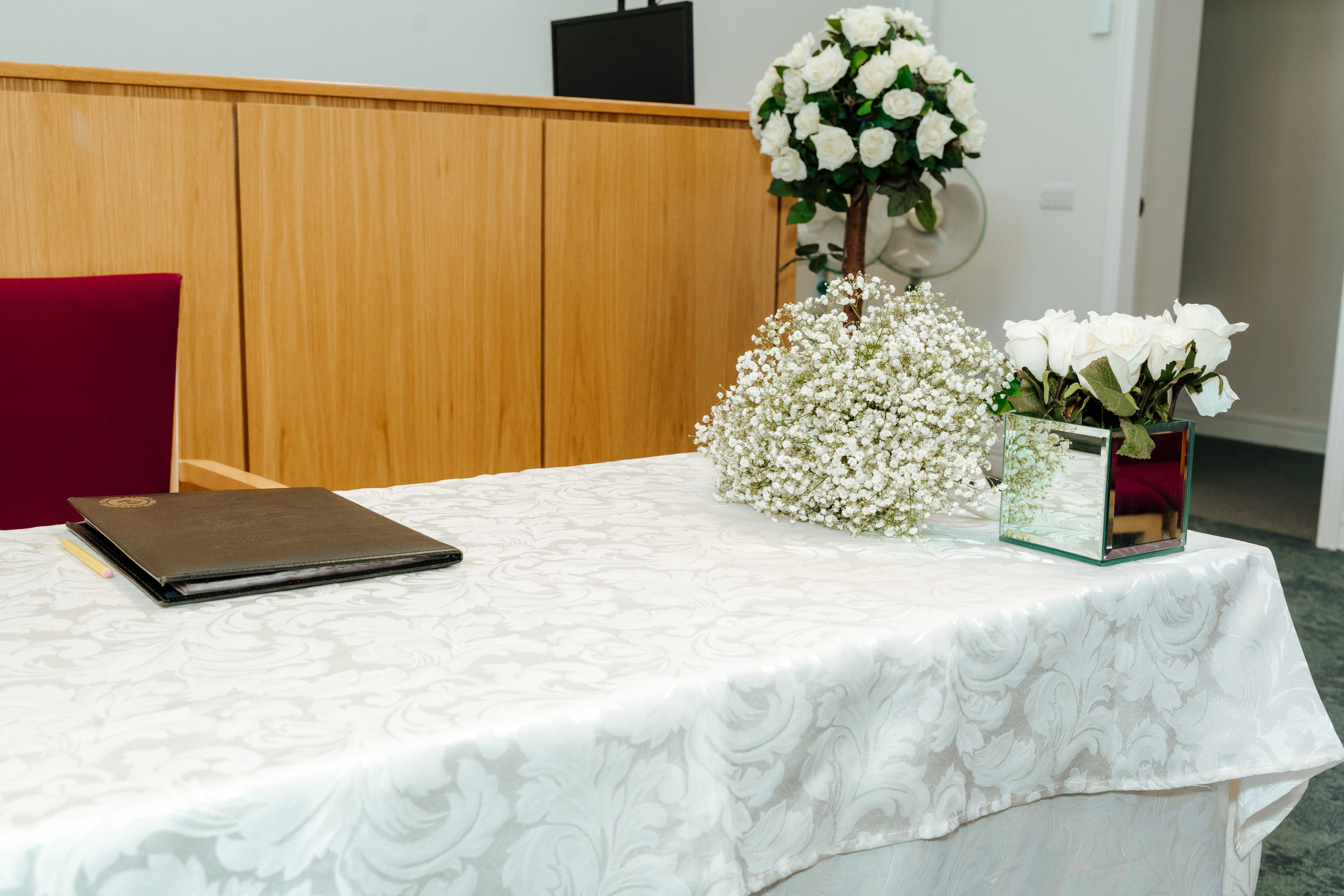 White wedding flowers and elegant ceremony details arranged at Midsomer Court for Andrey and Elena's civil wedding.