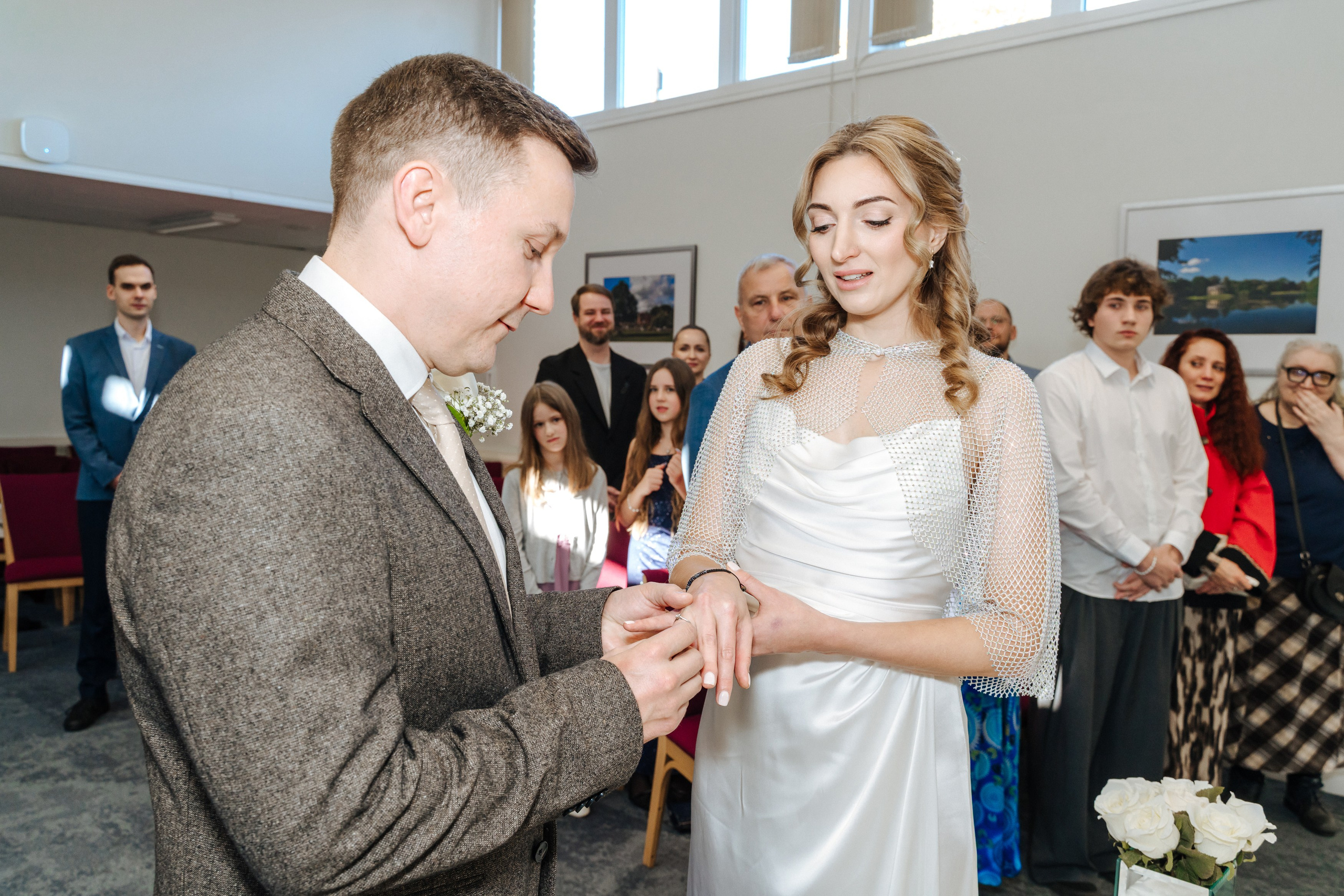 Andrey and Elena standing together during their wedding ceremony at Beaconsfield Old Town Registration Office.