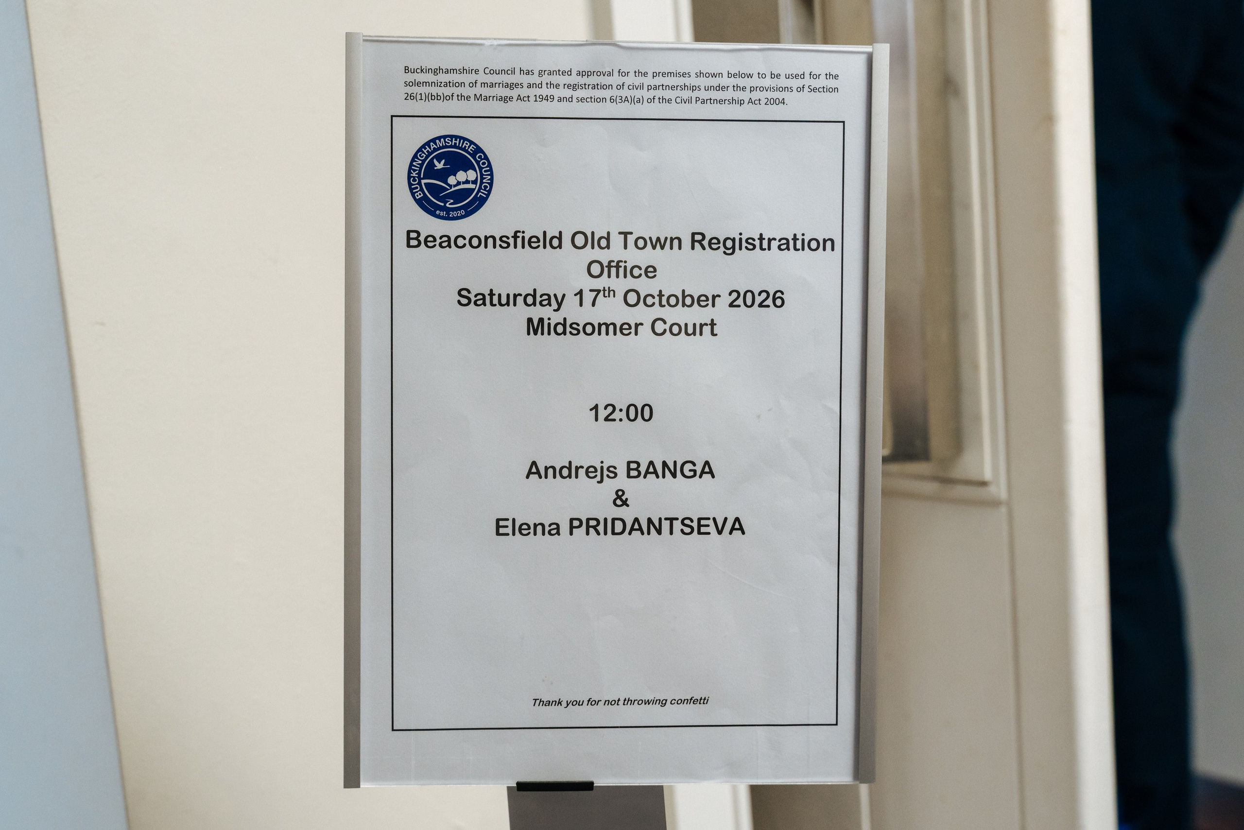 Wedding ceremony details displayed at Beaconsfield Old Town Registration Office for Andrey and Elena's wedding.
