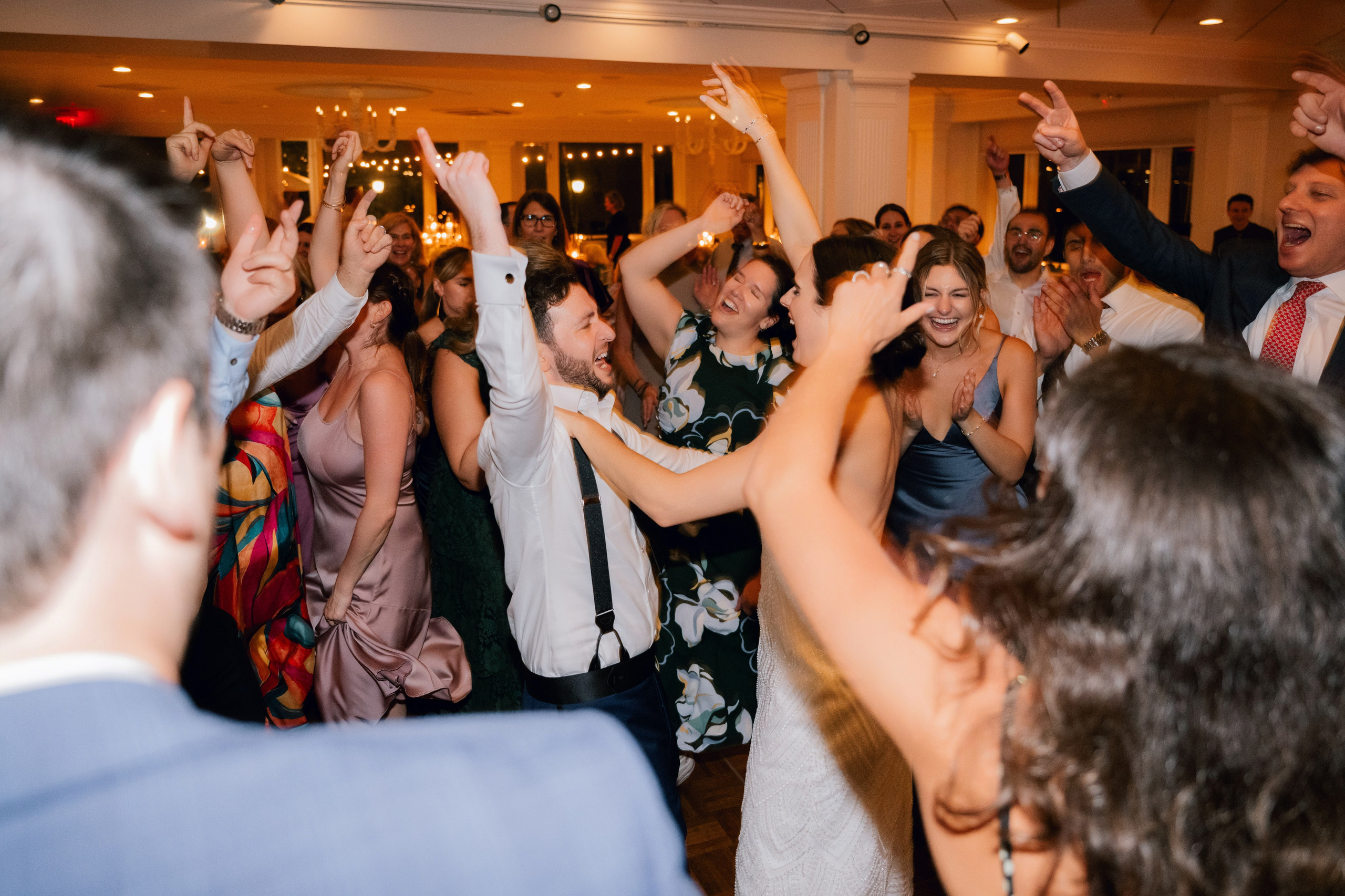 a group of people dancing and having a party