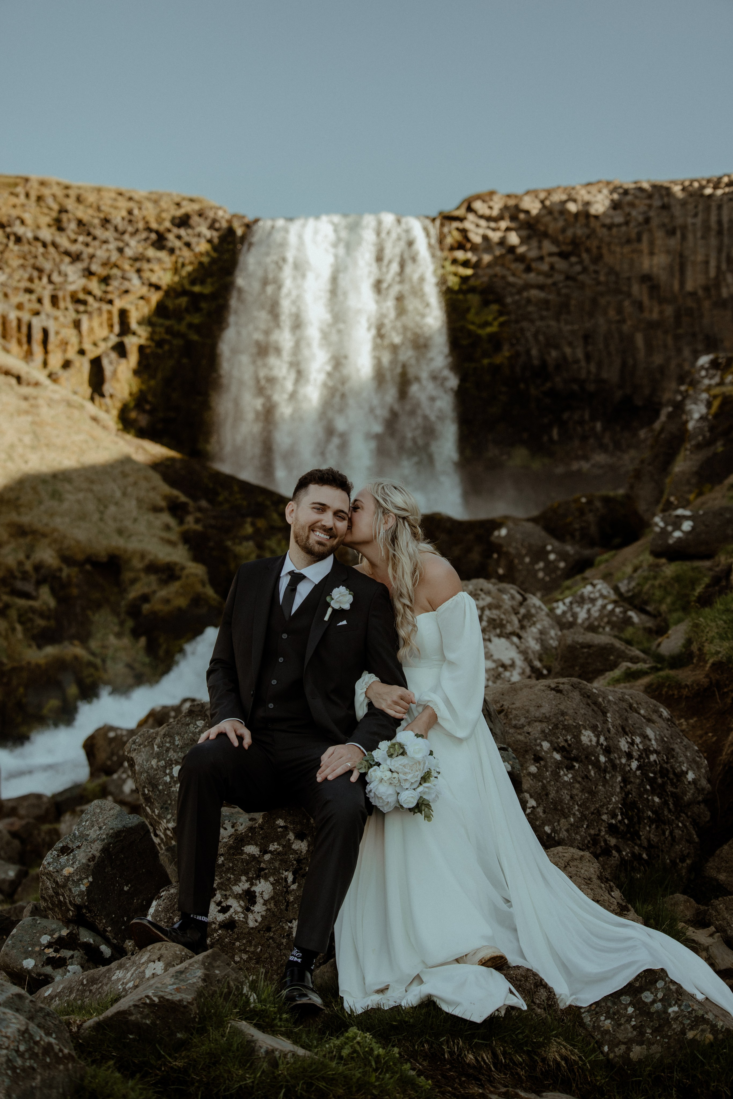 Iceland elopement at Budir with midnight sun wedding photos at black sand beach. Iceland elopement photographer & videographer