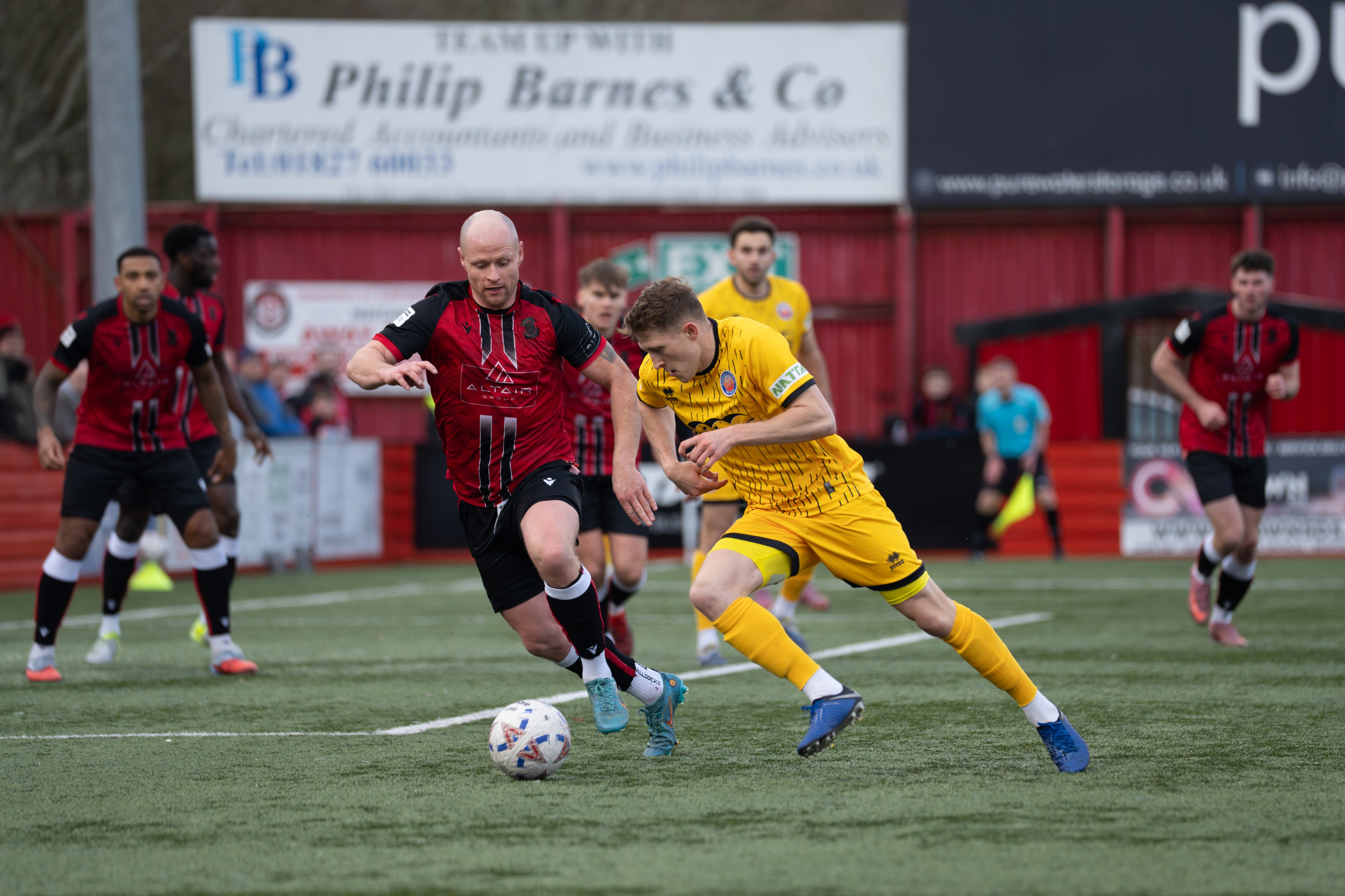 Tamworth, England — February 14, 2026: Aldershot Town’s Cameron Hargreaves challenges for the ball during the Enterprise National League match between Tamworth and Aldershot Town at The Lamb Ground. Photo: Jay Soundo