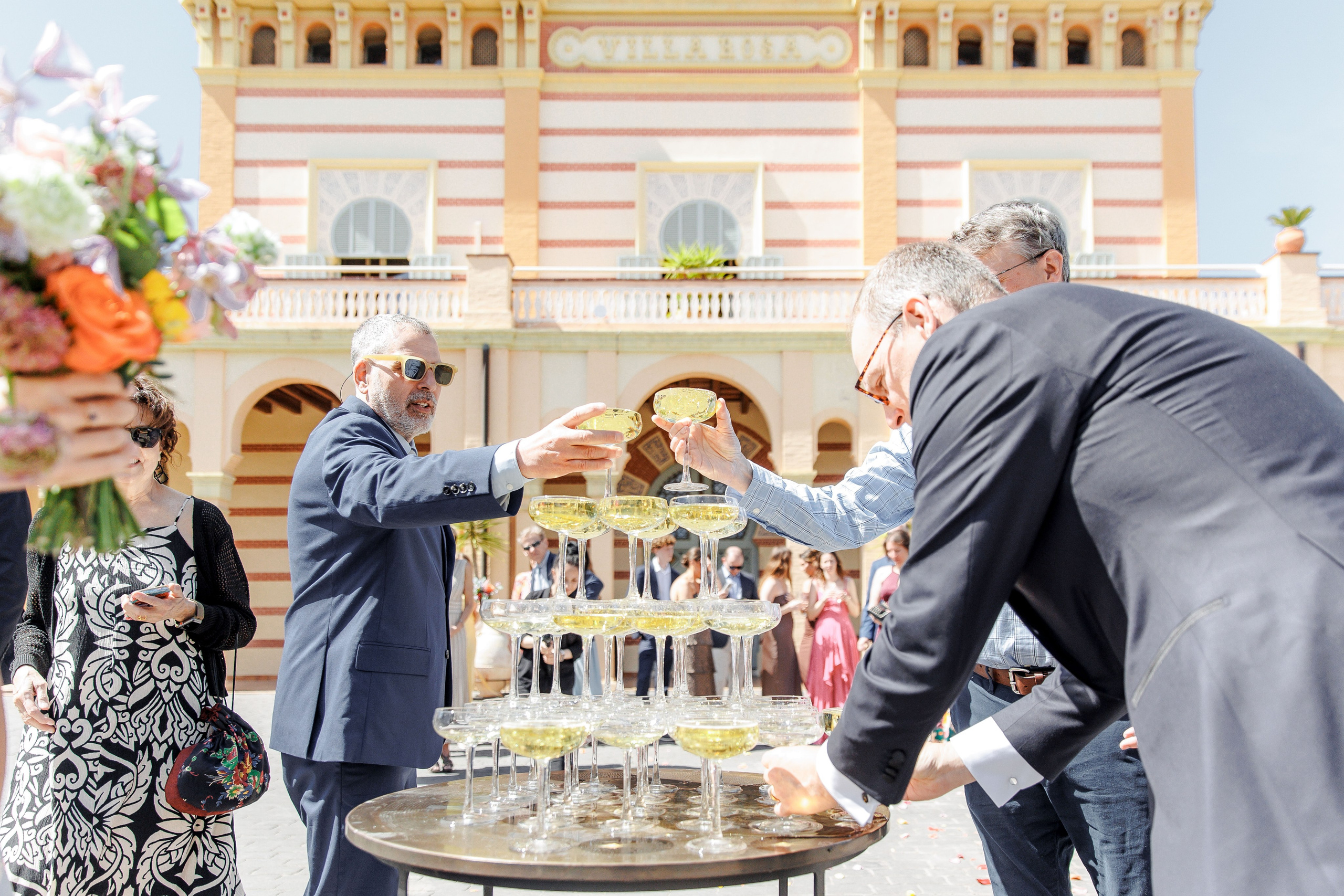 Guests celebrating during a wedding cocktail hour in Barcelona, Spain