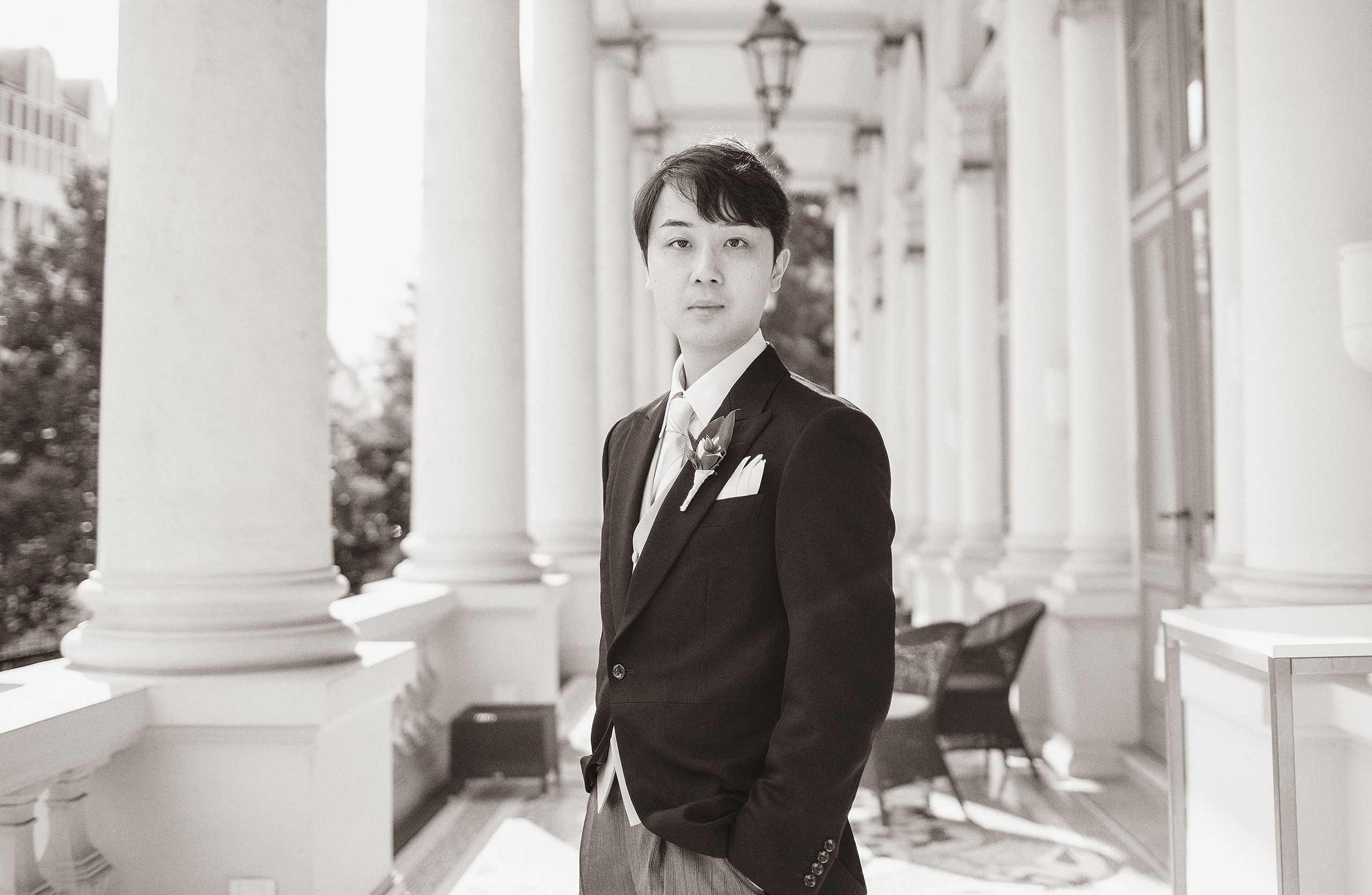 Simple, elegant, classical portrait of the groom on the grounds of the Palais Coburg.
