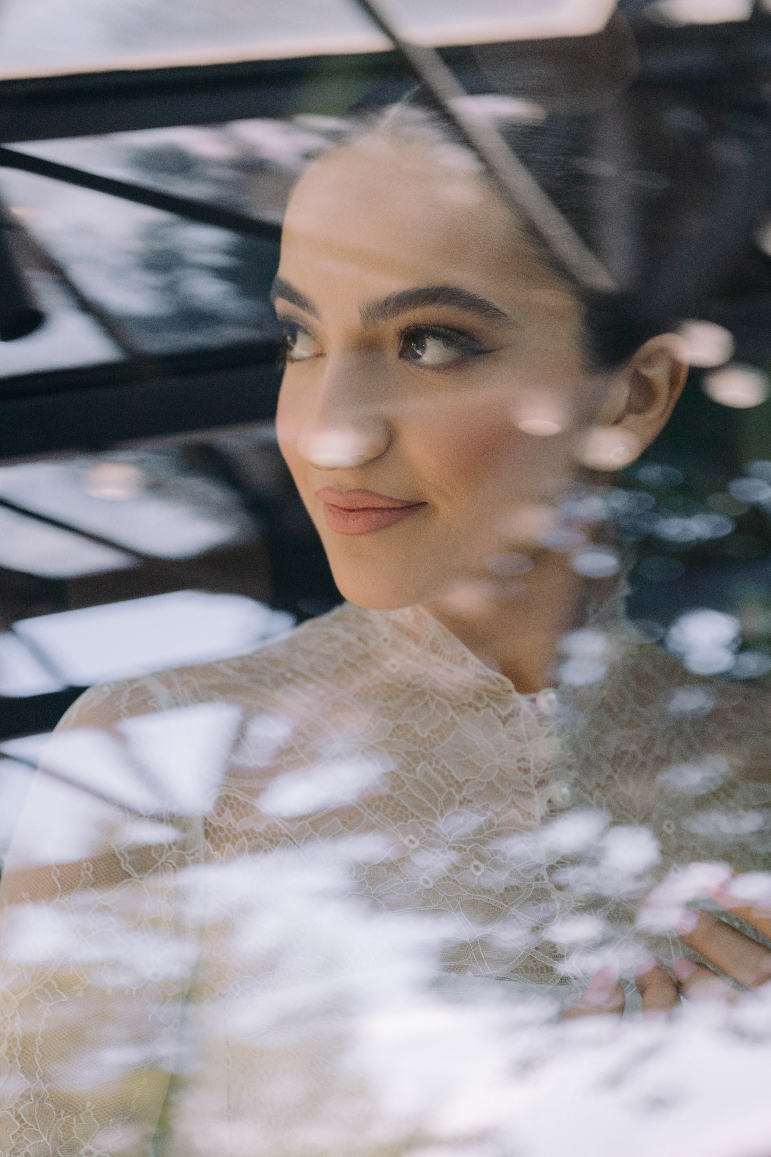 a woman is looking through a window