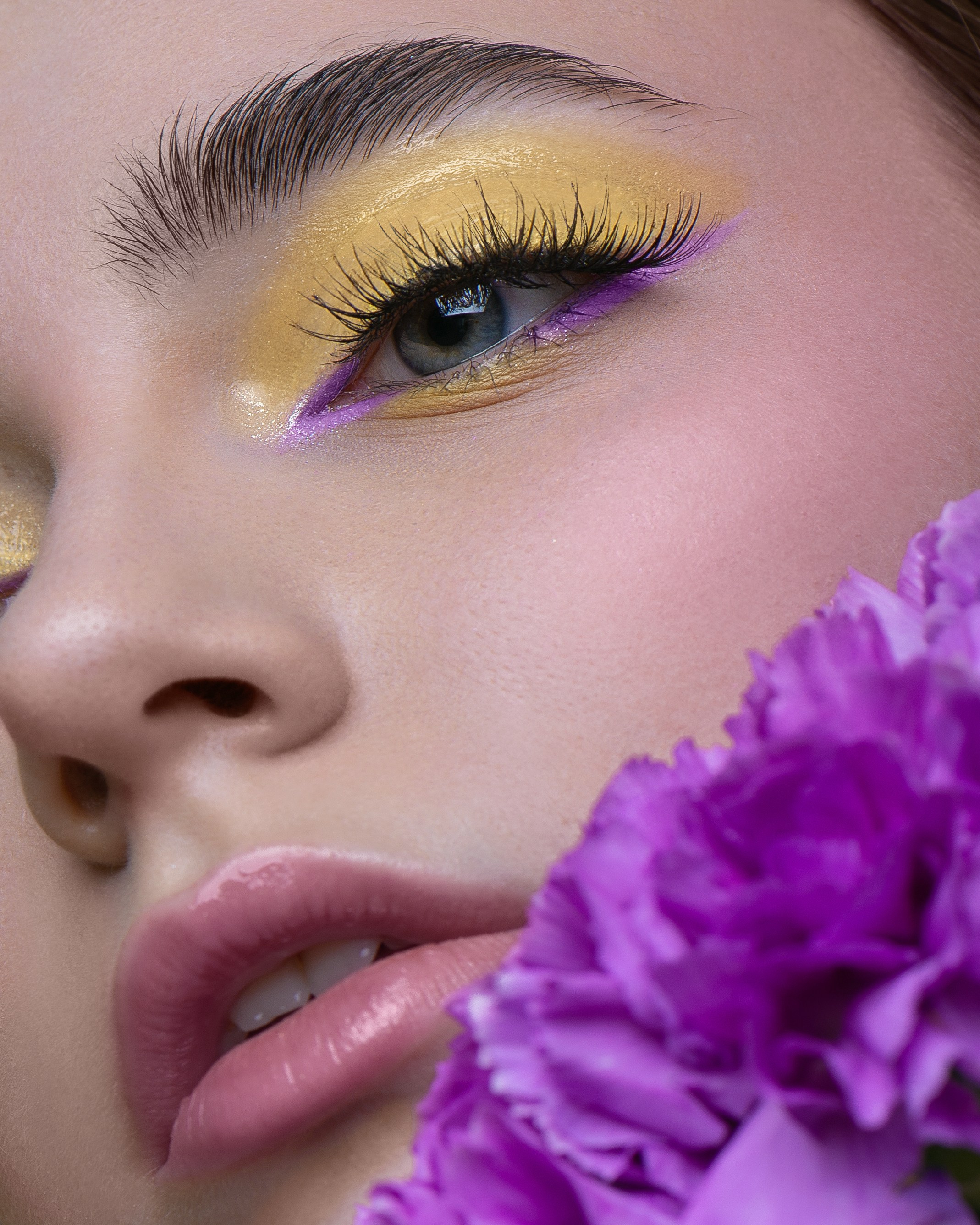 Makeup artist portfolio photoshoot with sharp details, capturing vibrant eyeshadow and smooth skin texture.