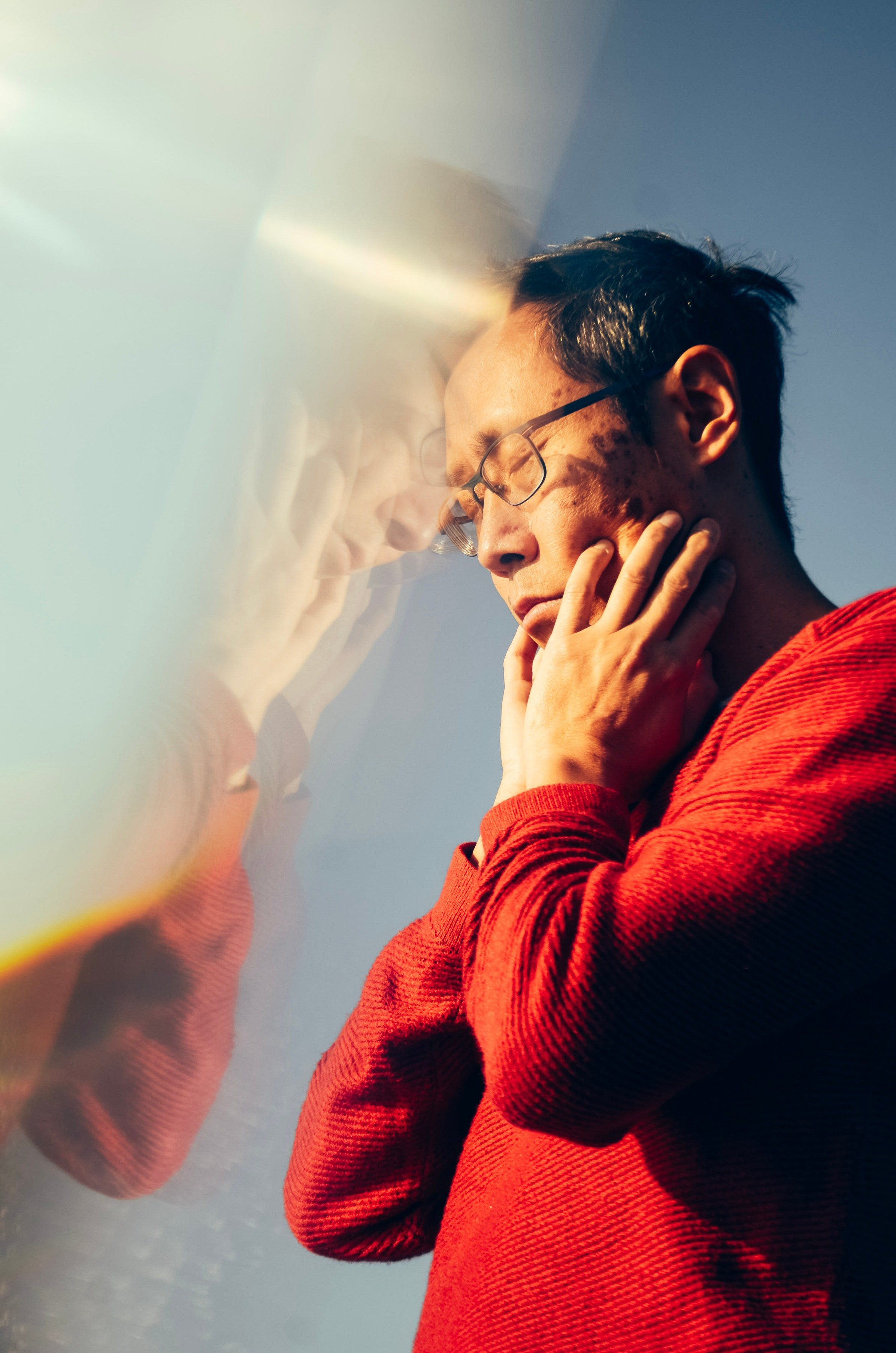 Artistic portrait with gentle movement blur and warm light, captured during a creative session in Solihull.