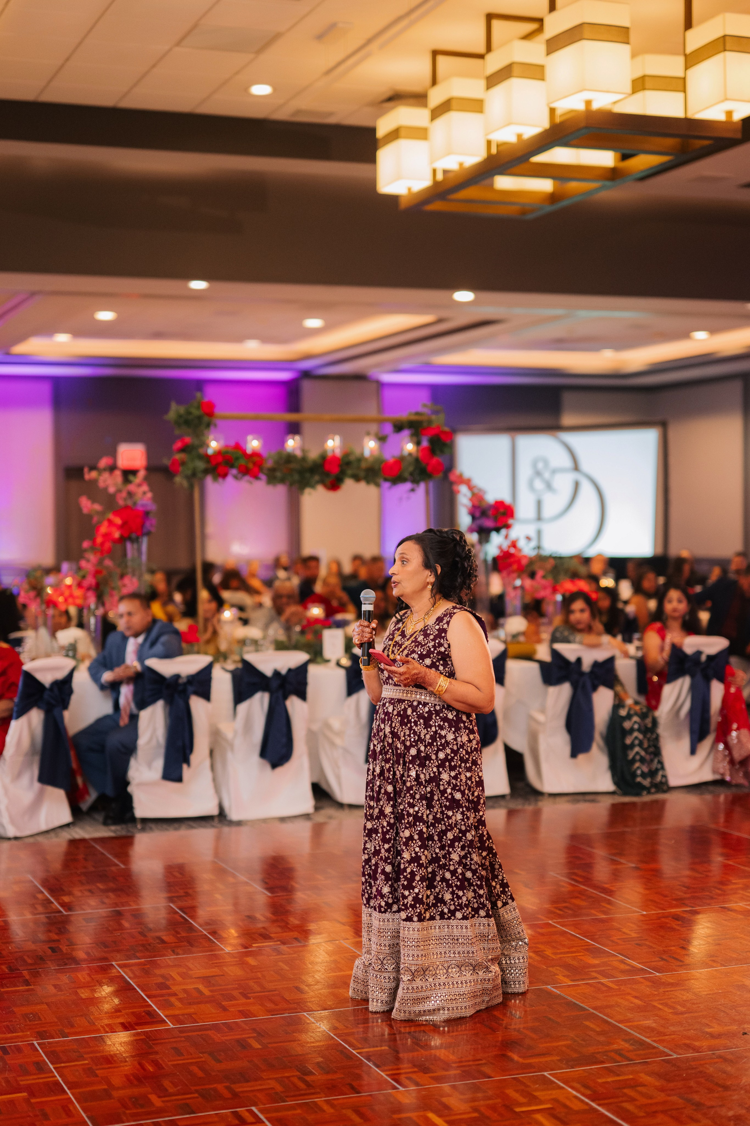 a woman in a dress is dancing on the dance floor