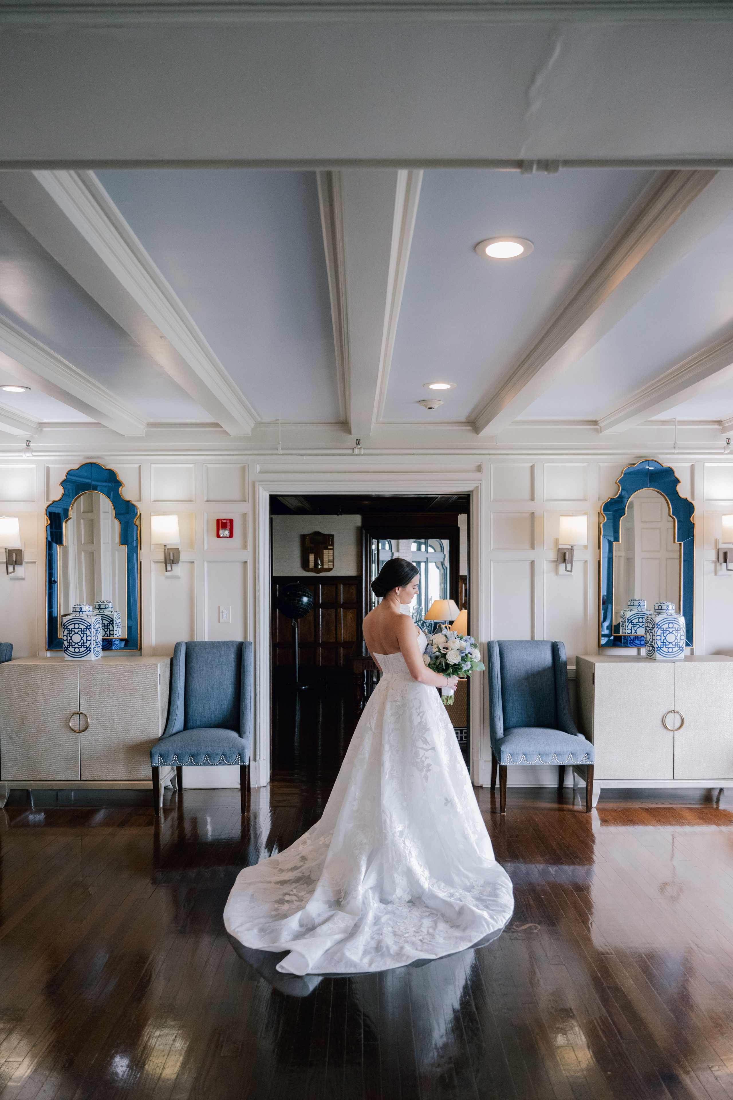 a bride in a white dress is standing in a room