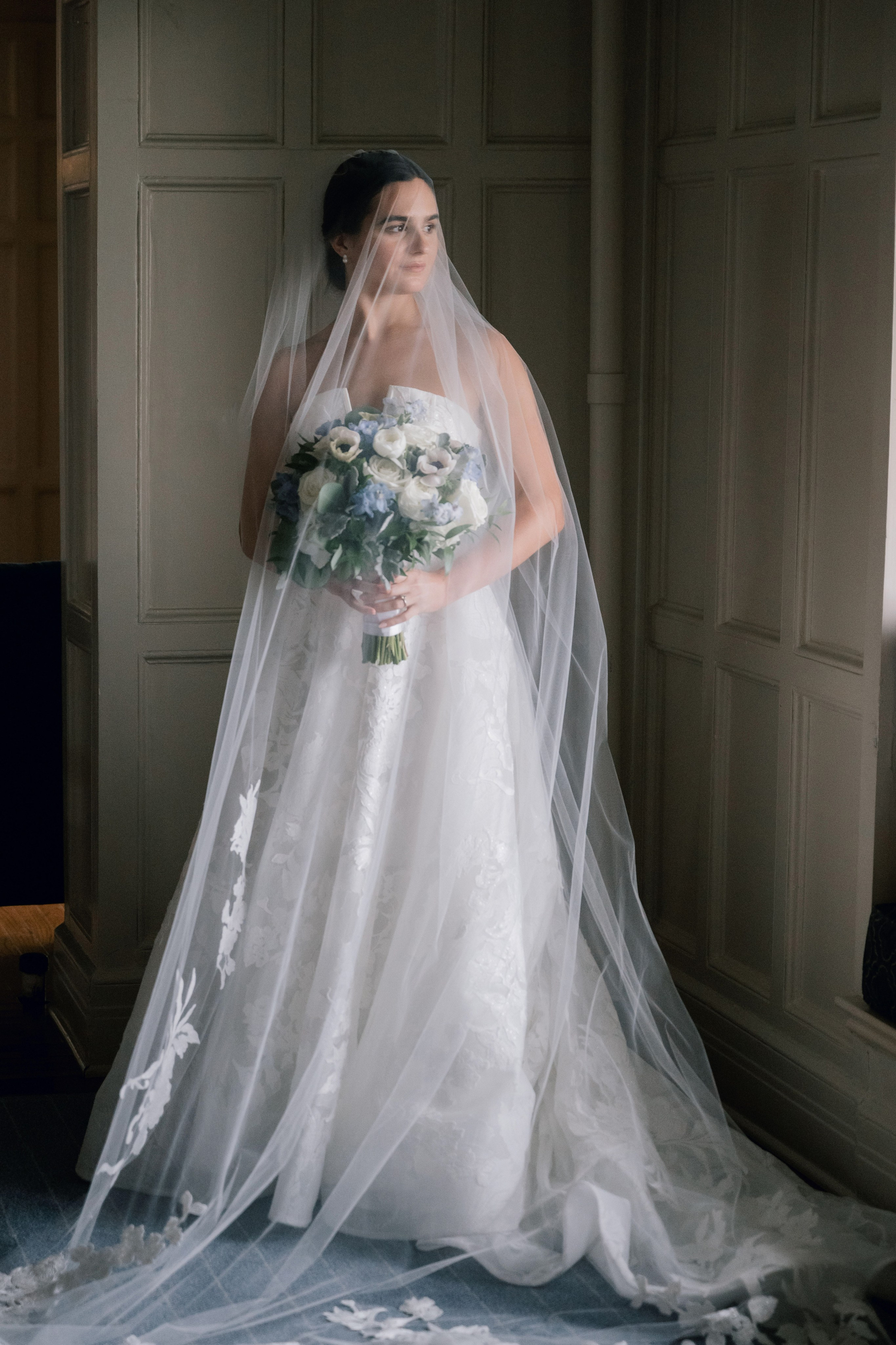 a bride in a wedding dress and veil