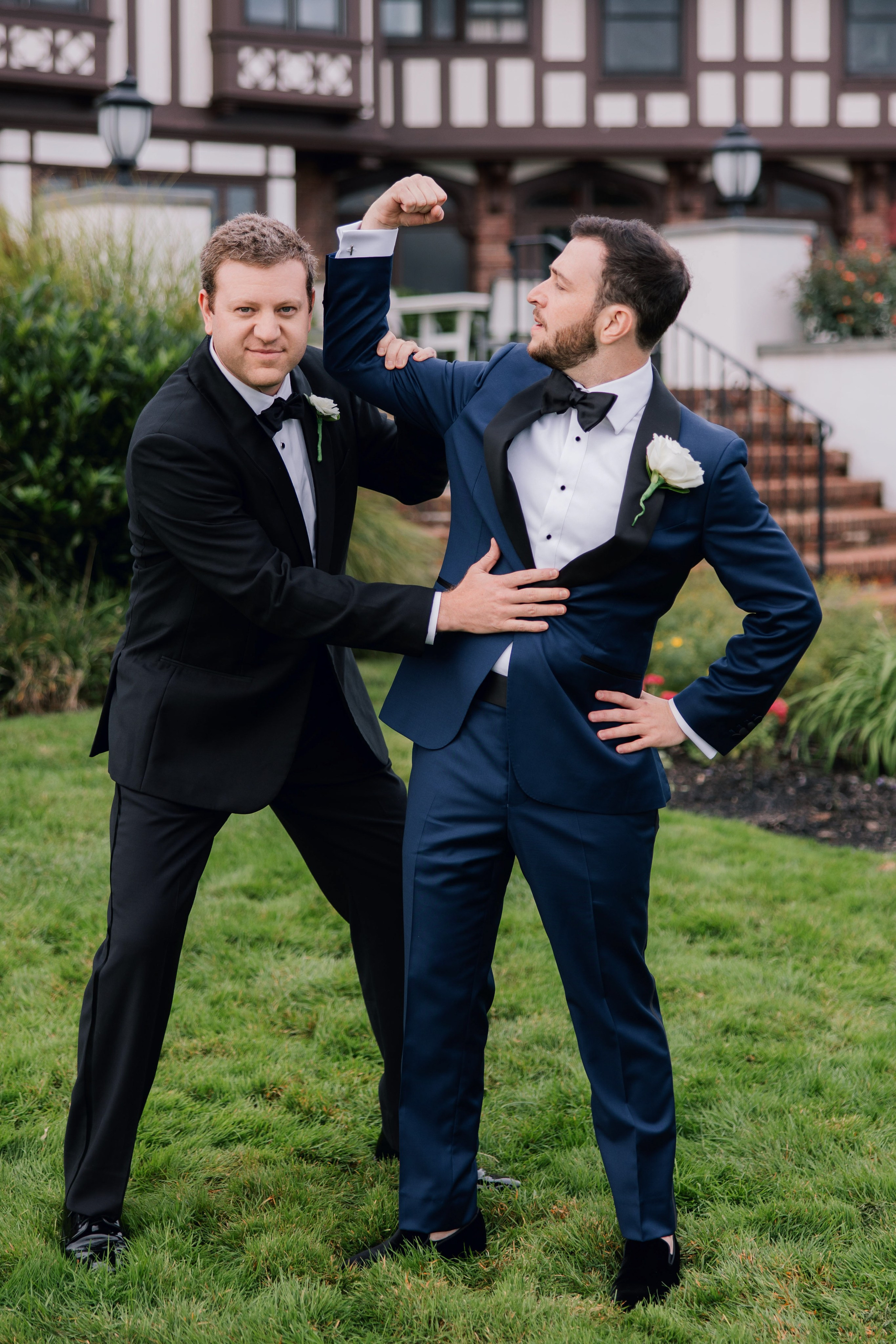 groom helping his friend with his tie