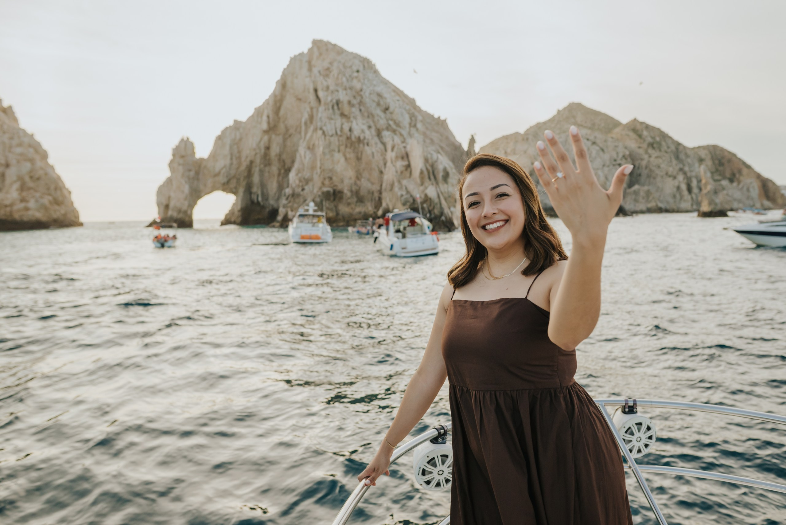 Engagement ring with El Arco Los Cabos in the background