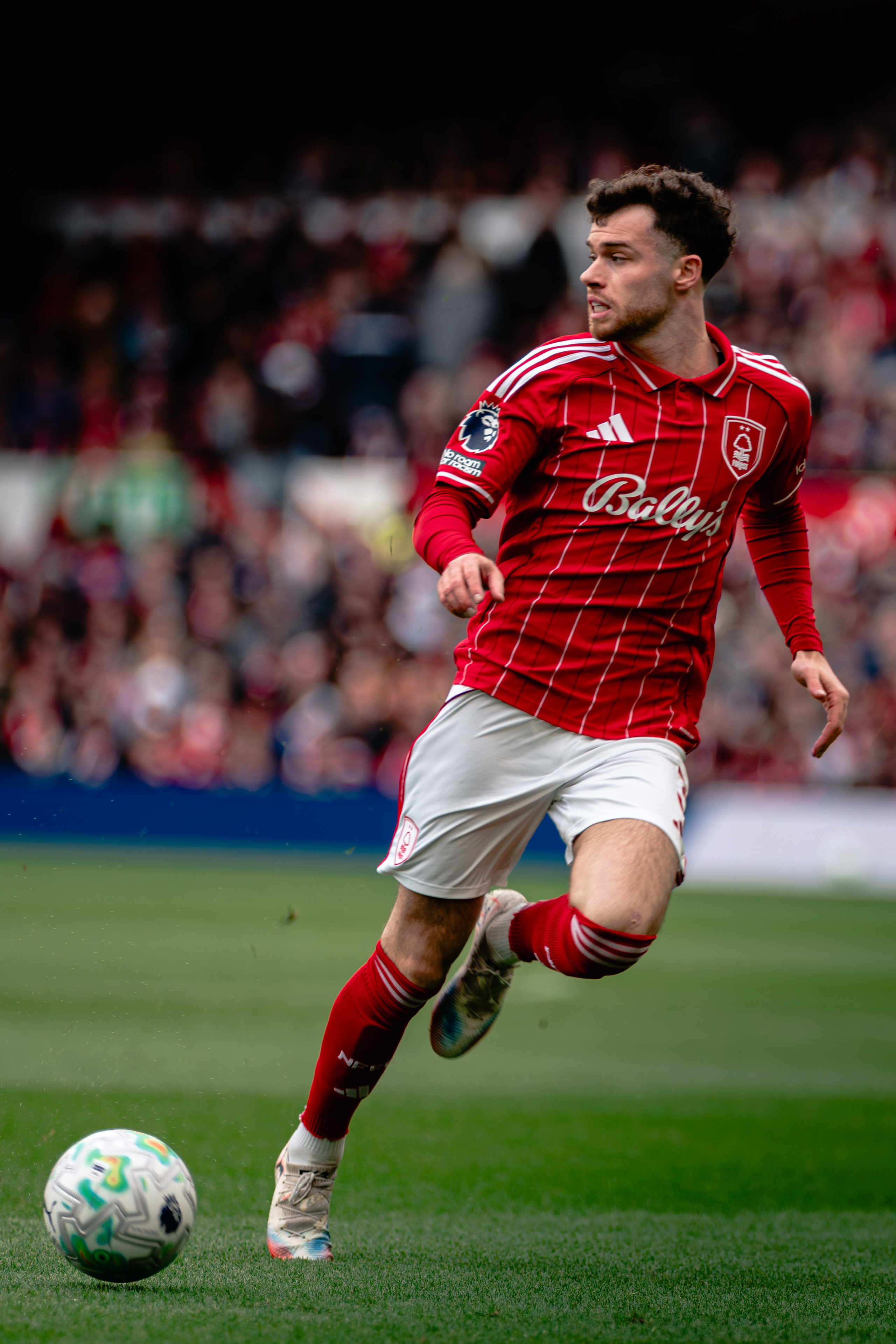 Nottingham Forest player carrying the ball during the Premier League fixture against Fulham.