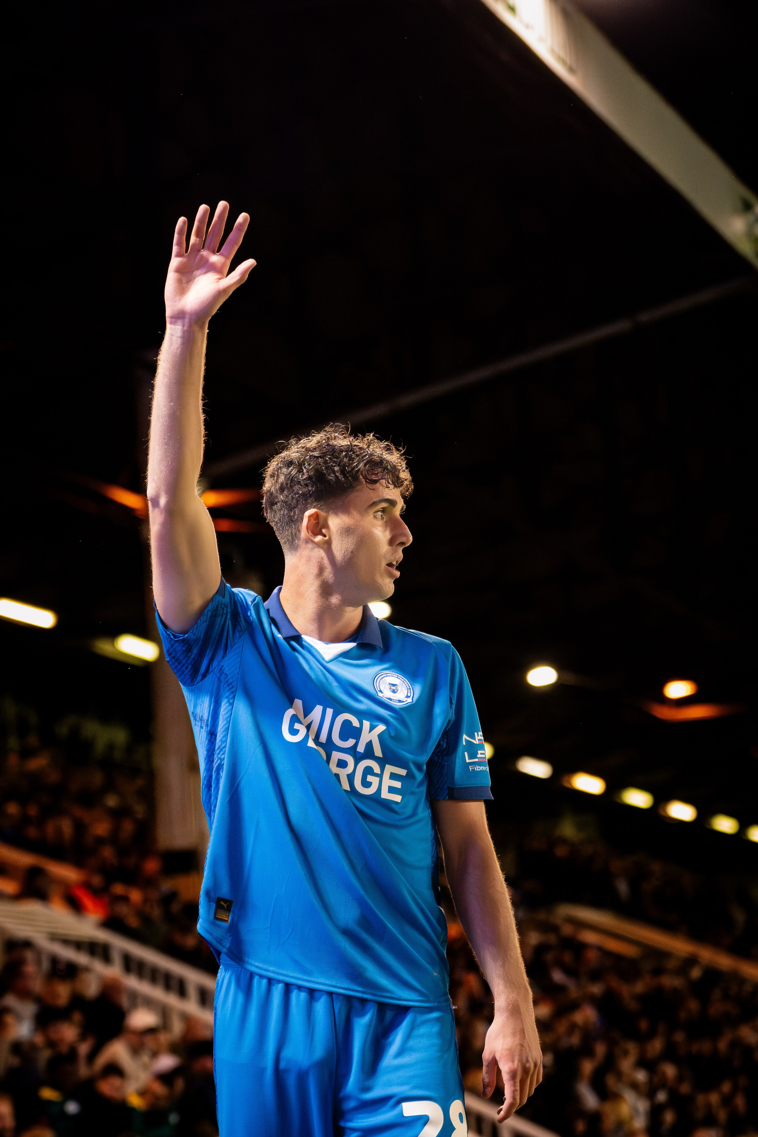 Peterborough United player acknowledging supporters during the League One match against Mansfield Town