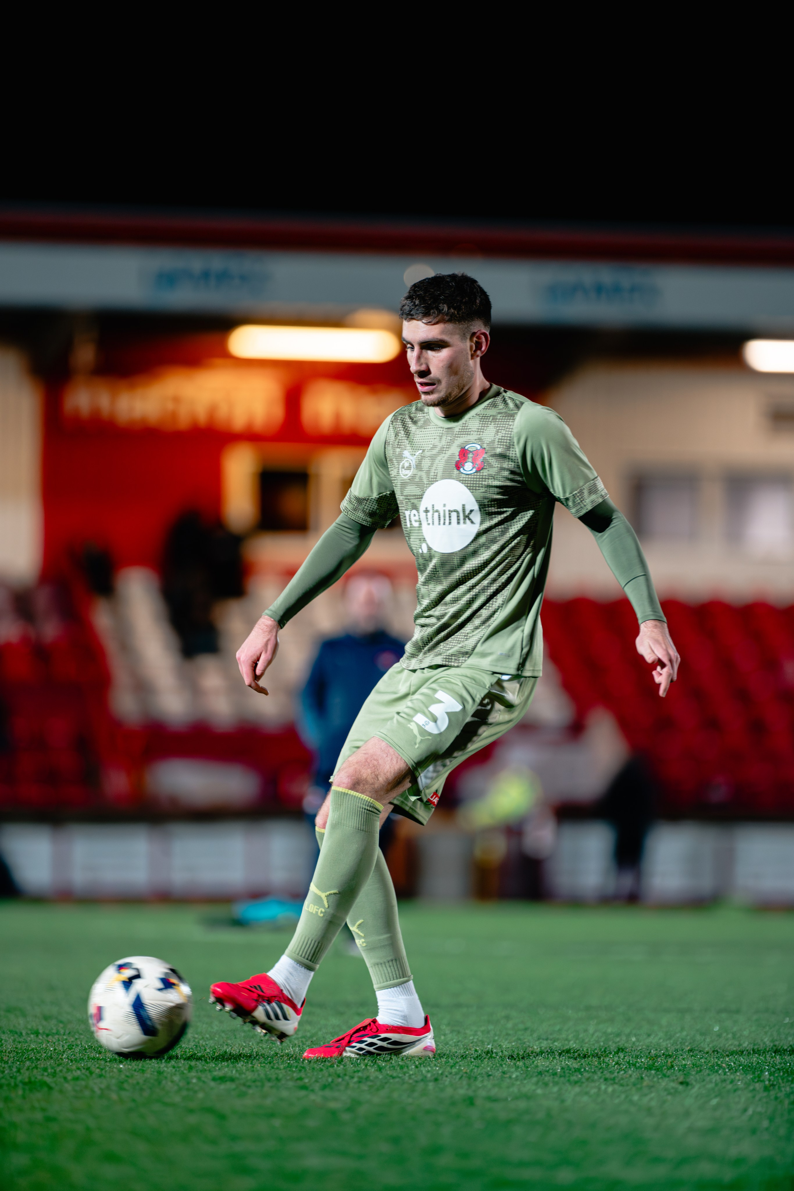 Leyton Orient player controlling the ball during the League One fixture against Stevenage at the Lamex Stadium
