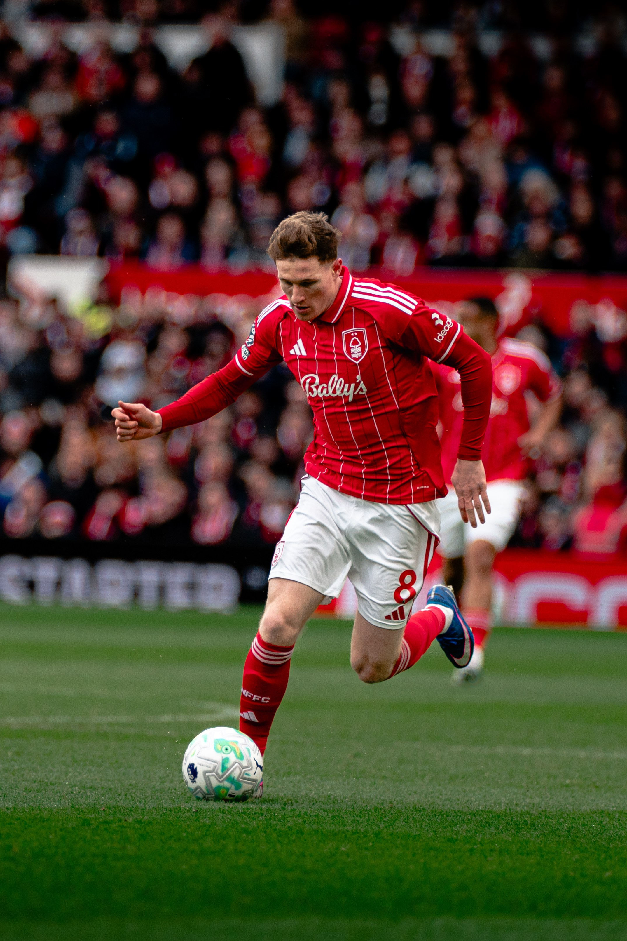 Nottingham Forest player dribbling with the ball during the Premier League match against Fulham at the City Ground