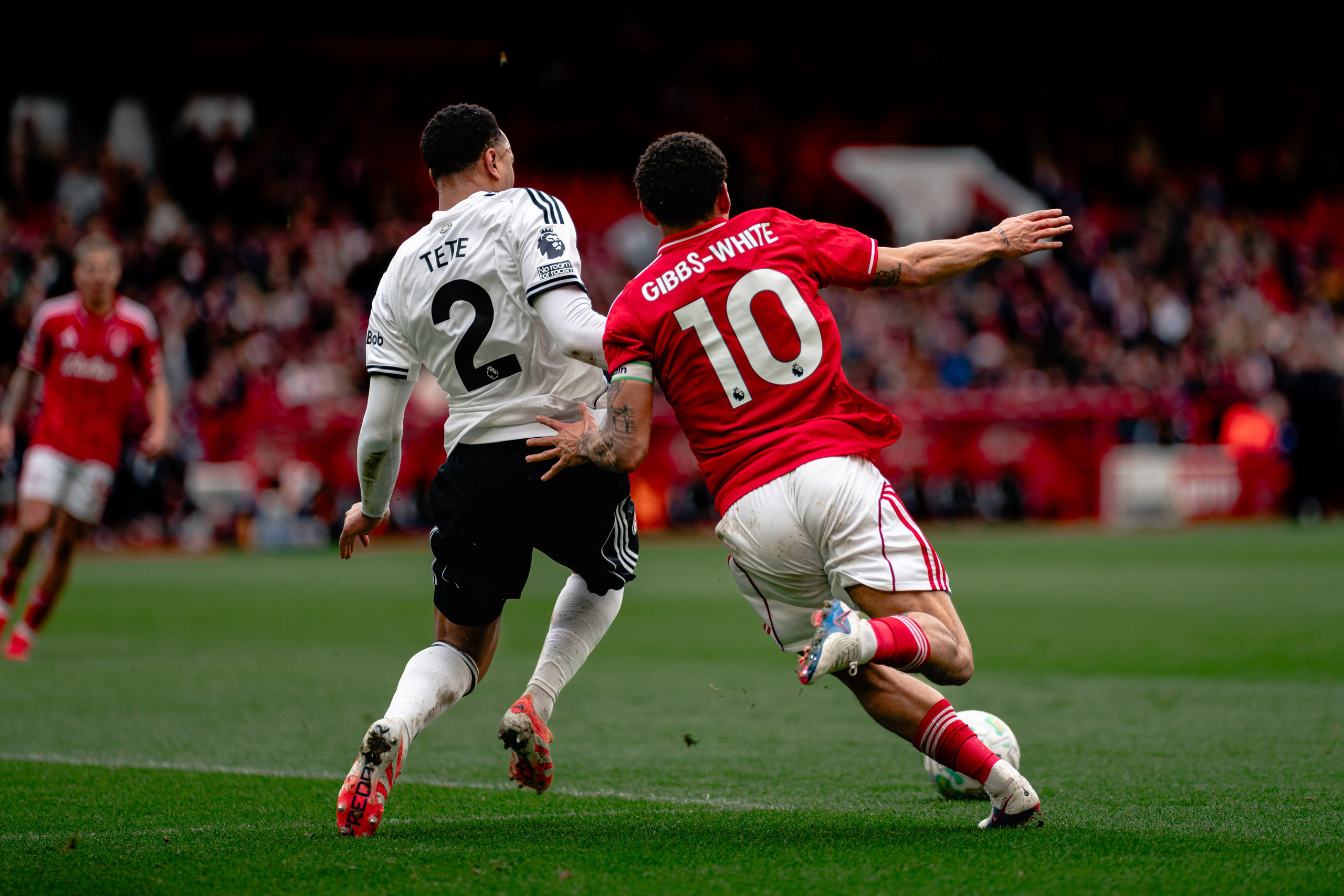 Nottingham Forest and Fulham players competing for possession during their Premier League fixture at the City Ground