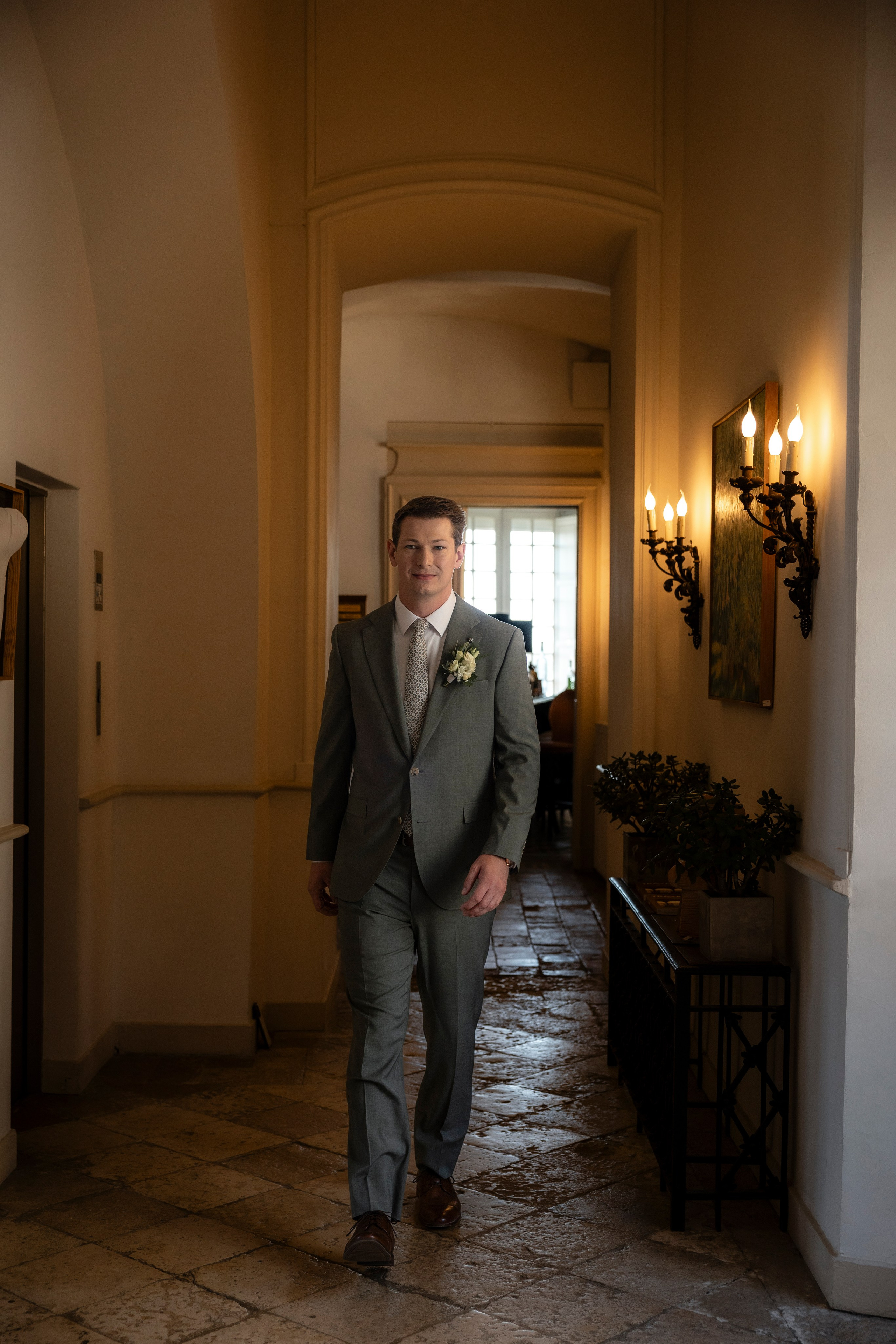 Groom portrait in soft natural light at Château Mercuès