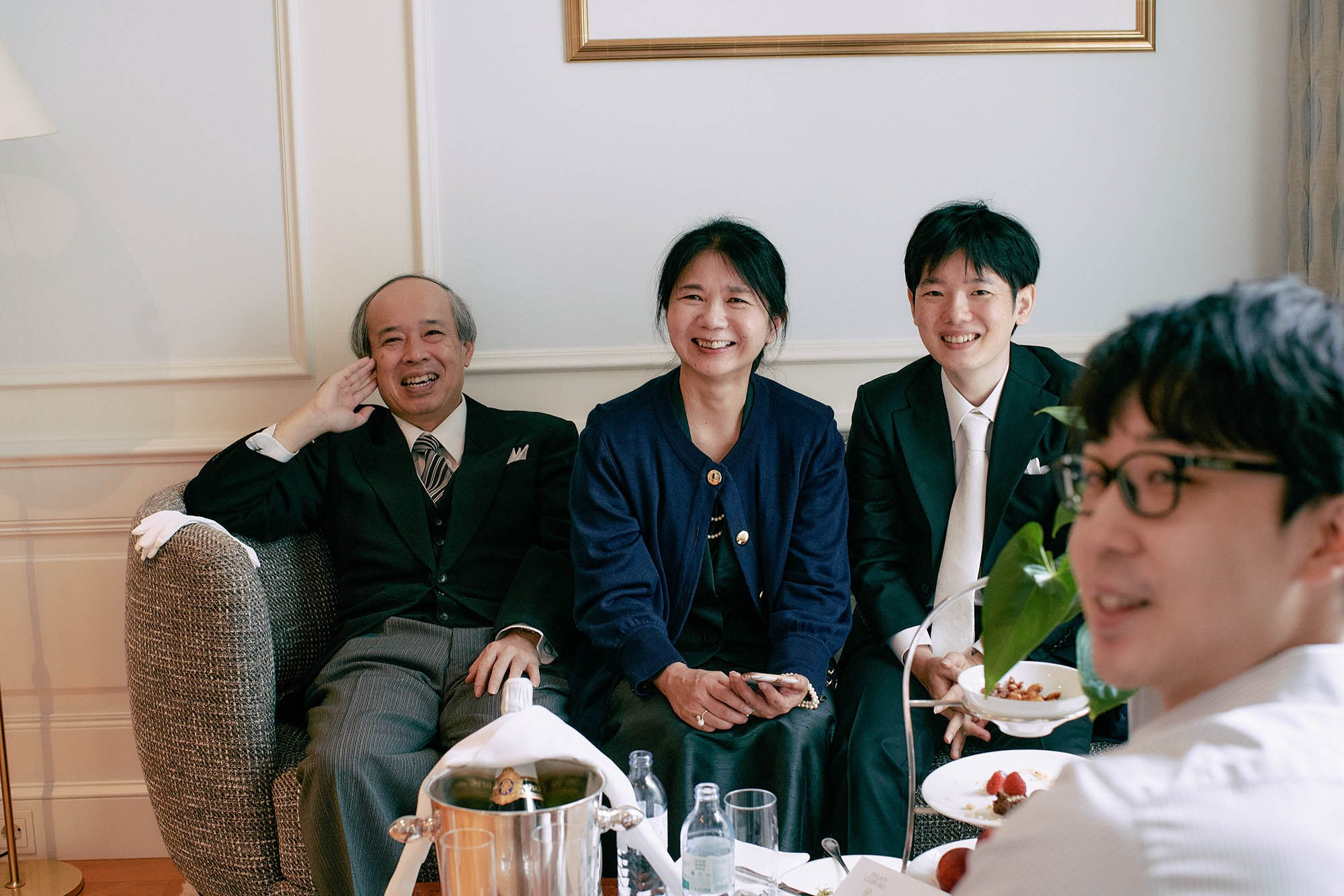 A ring at the suite interrupts the revelry.