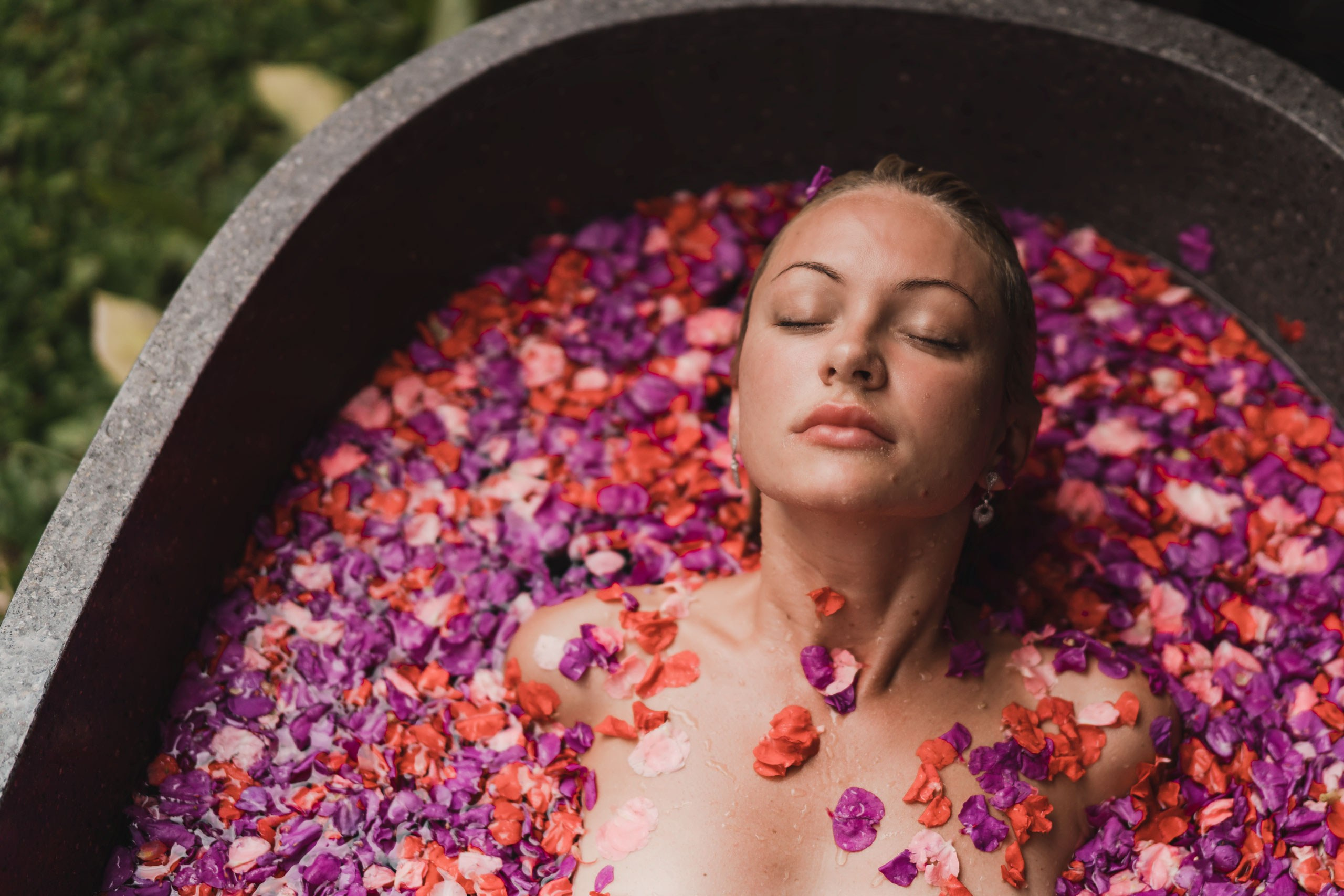 Portrait among blooming bougainvillea in the garden