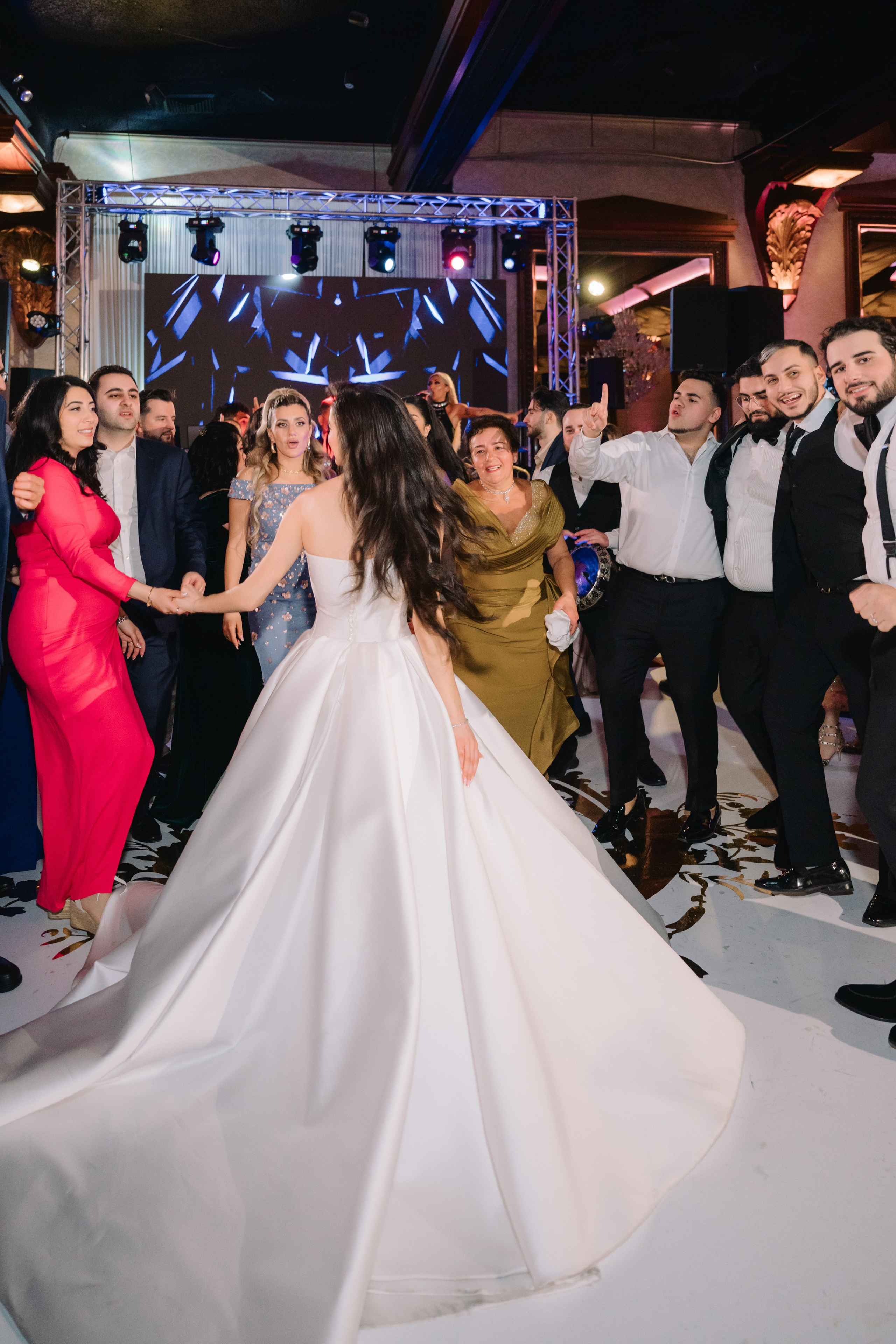 a bride and groom dancing at a wedding reception
