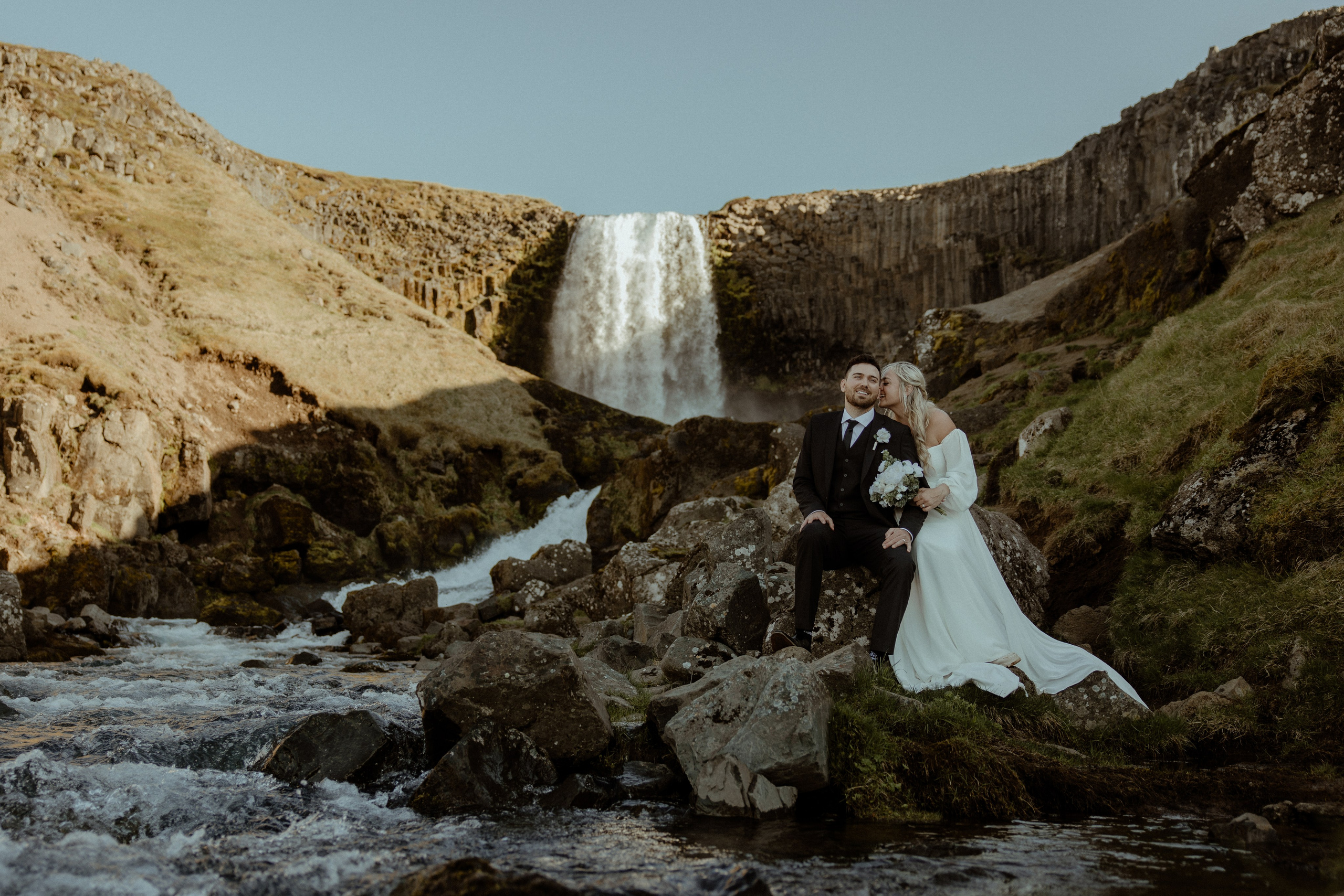 Iceland elopement at Budir with midnight sun wedding photos at black sand beach. Iceland elopement photographer & videographer
