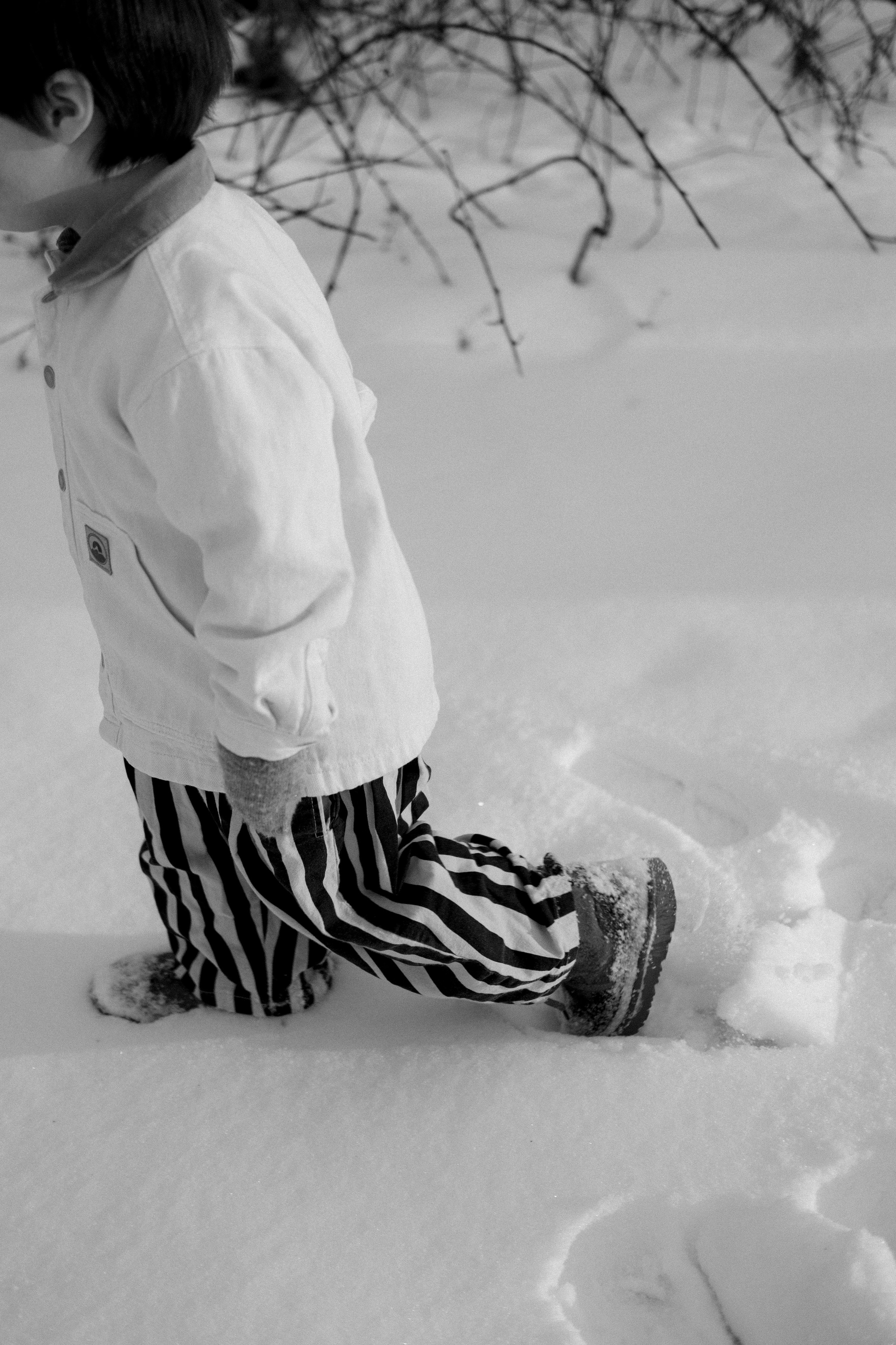 Footprints in fresh snow leading back to a cozy cottage near Richmond, VA — a quiet storytelling image.