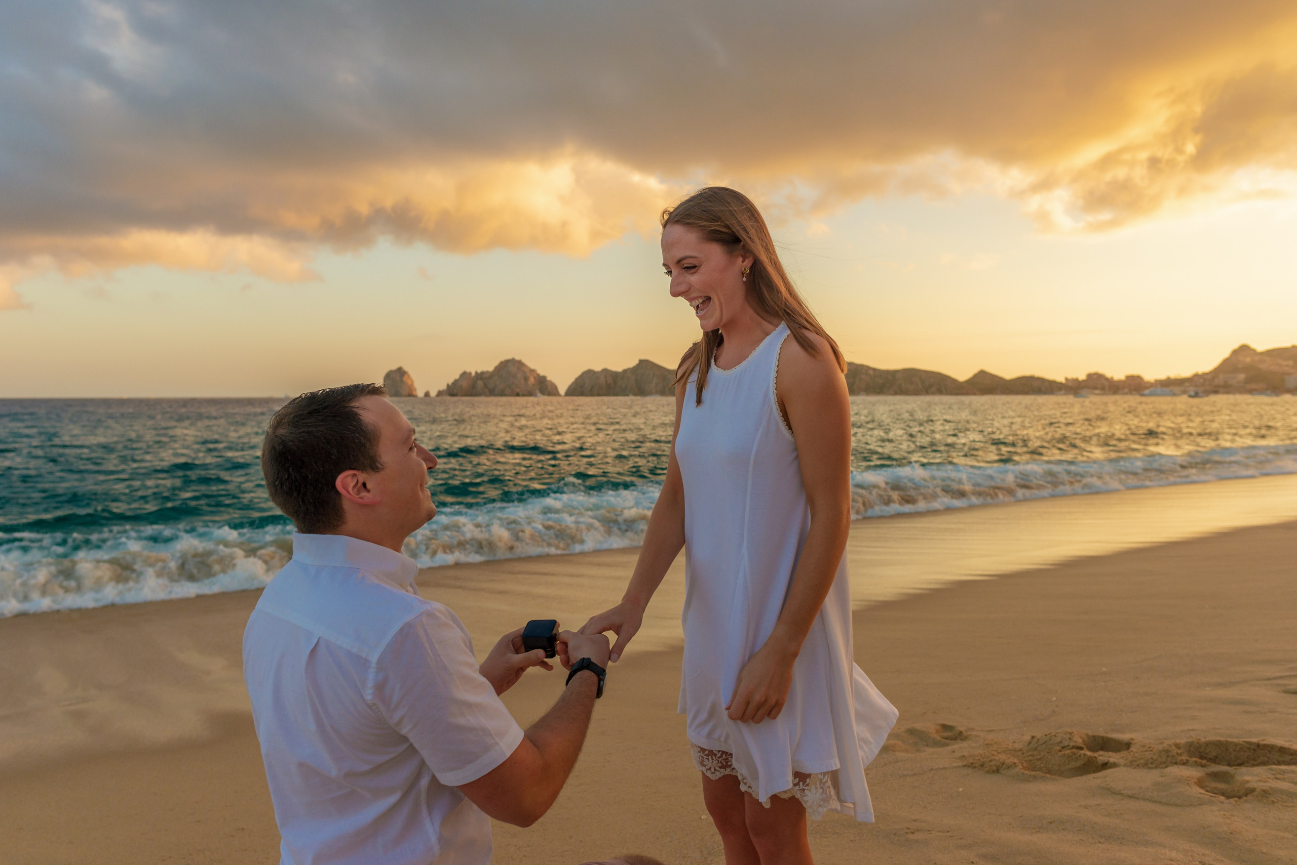 Woman reacting with surprise and excitement to marriage proposal Los Cabos Mexico