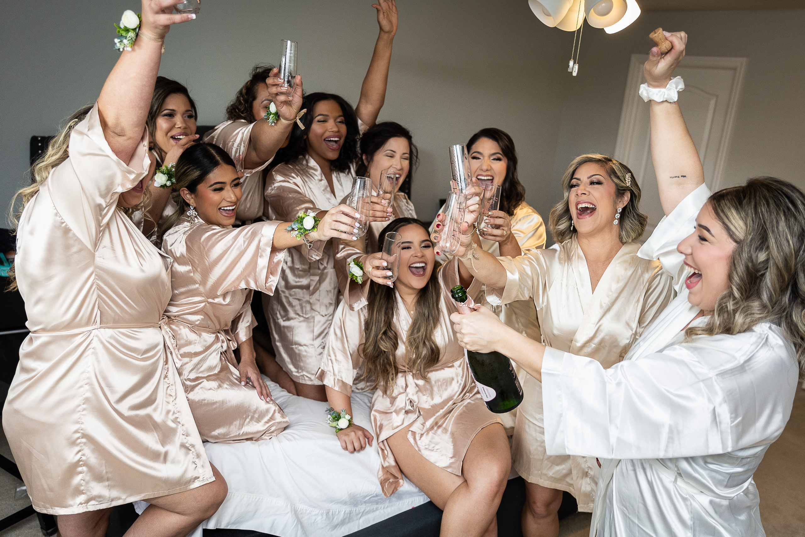 Bridesmaids and champagne bride morning