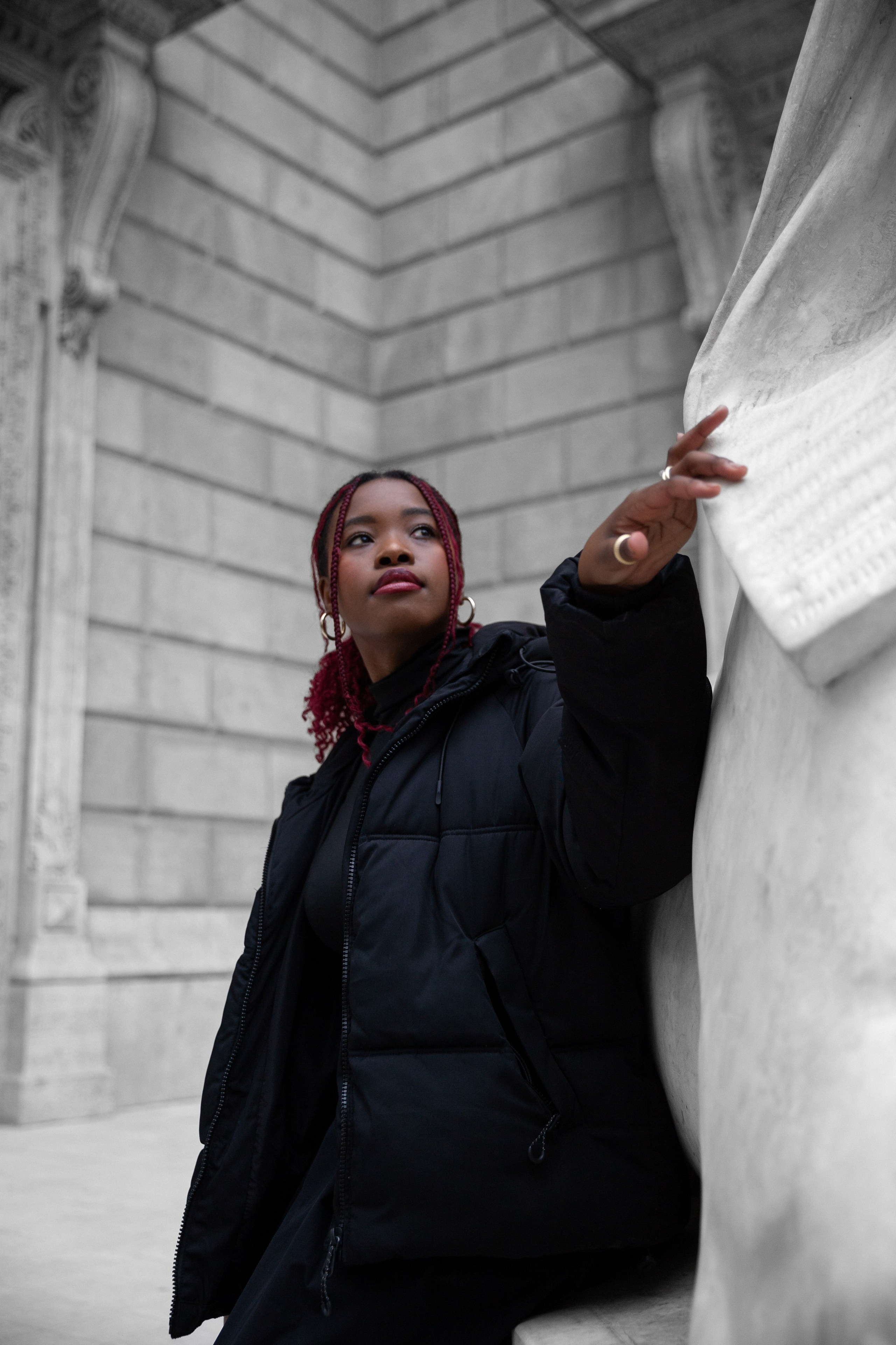 photo of a girl with red hair and a black down jacket