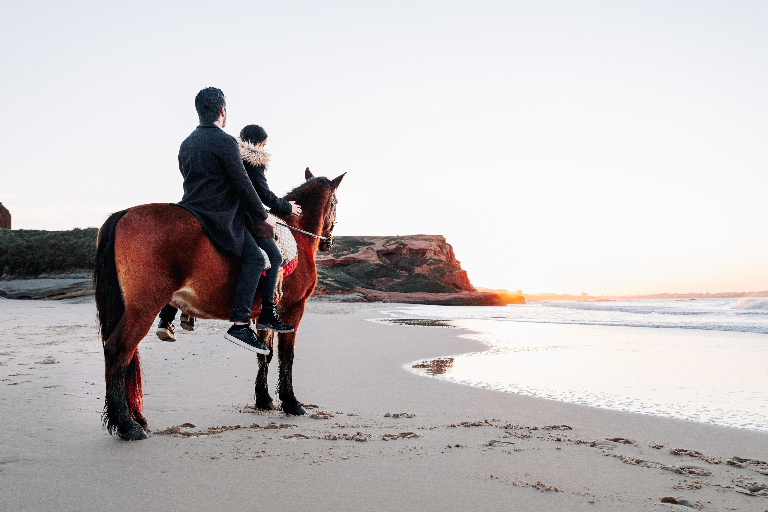 Photo session on horseback at Praia da Almagreira. Luxury Wedding Photography & Cinematic Films | Portugal & Destination Weddings | Ricardo & Mary Pictures