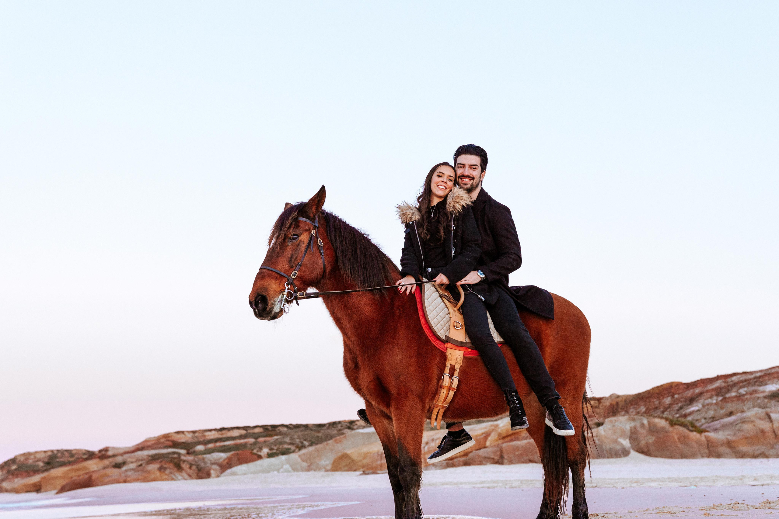 Photo session on horseback at Praia da Almagreira. Luxury Wedding Photography & Cinematic Films | Portugal & Destination Weddings | Ricardo & Mary Pictures