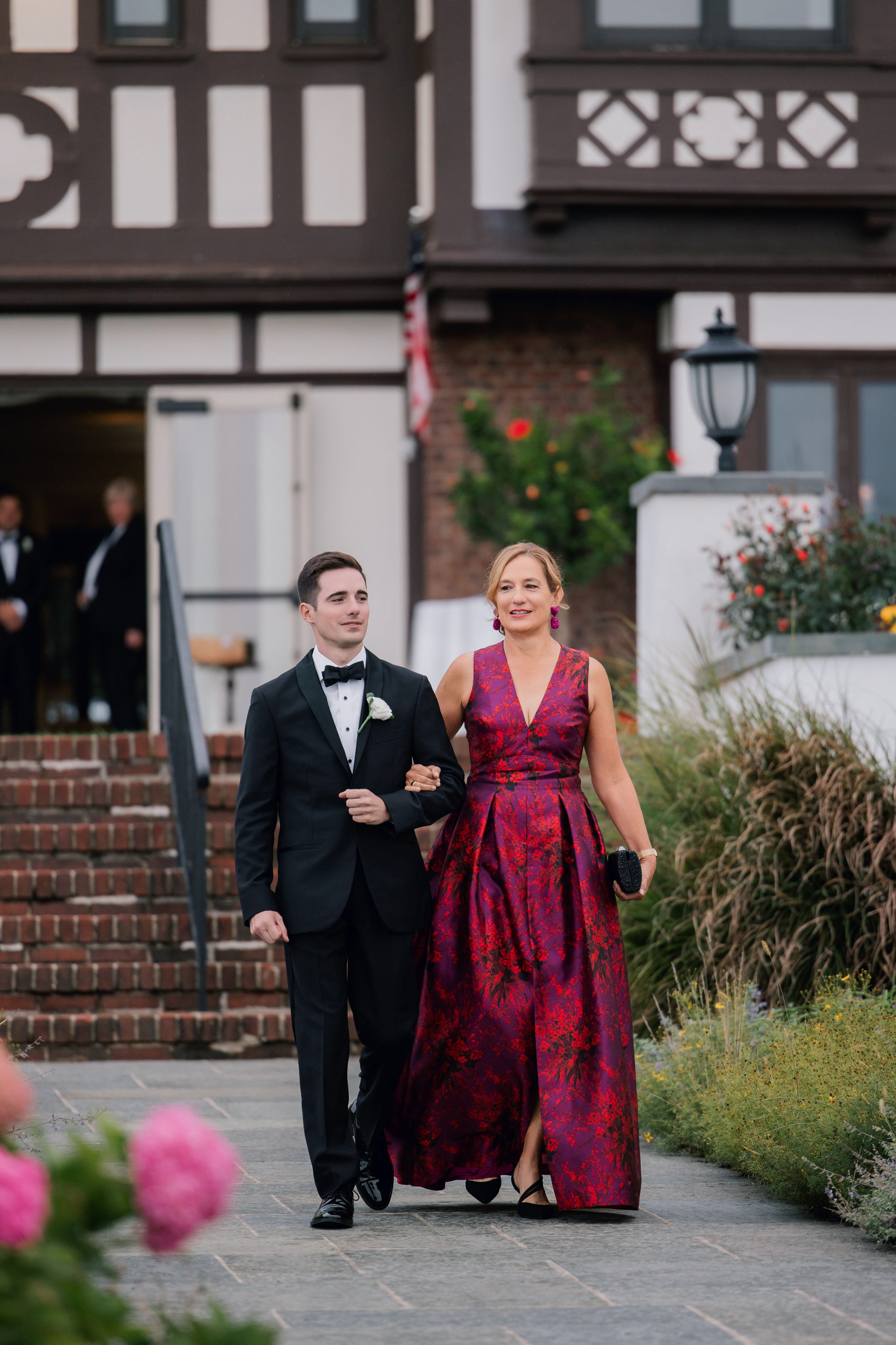 a man and woman walking down a sidewalk