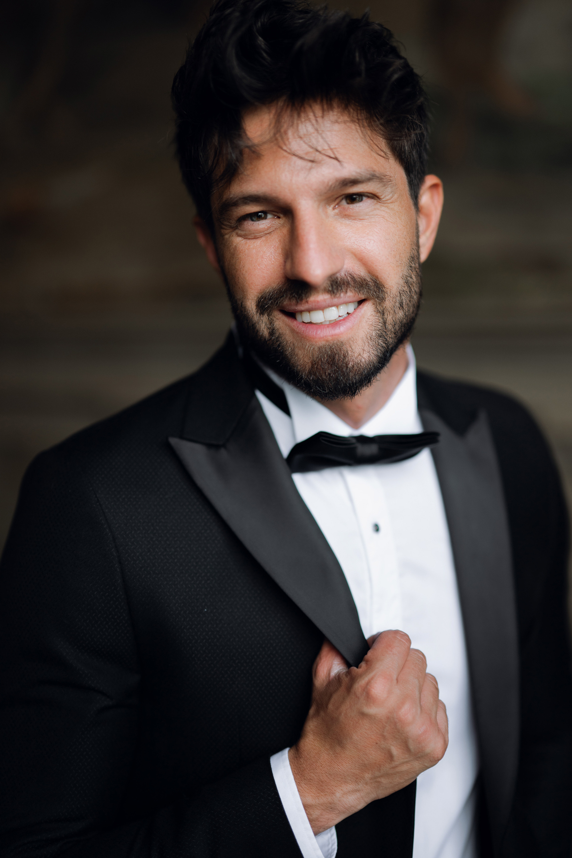 a man in a tuxed suit and bow tie