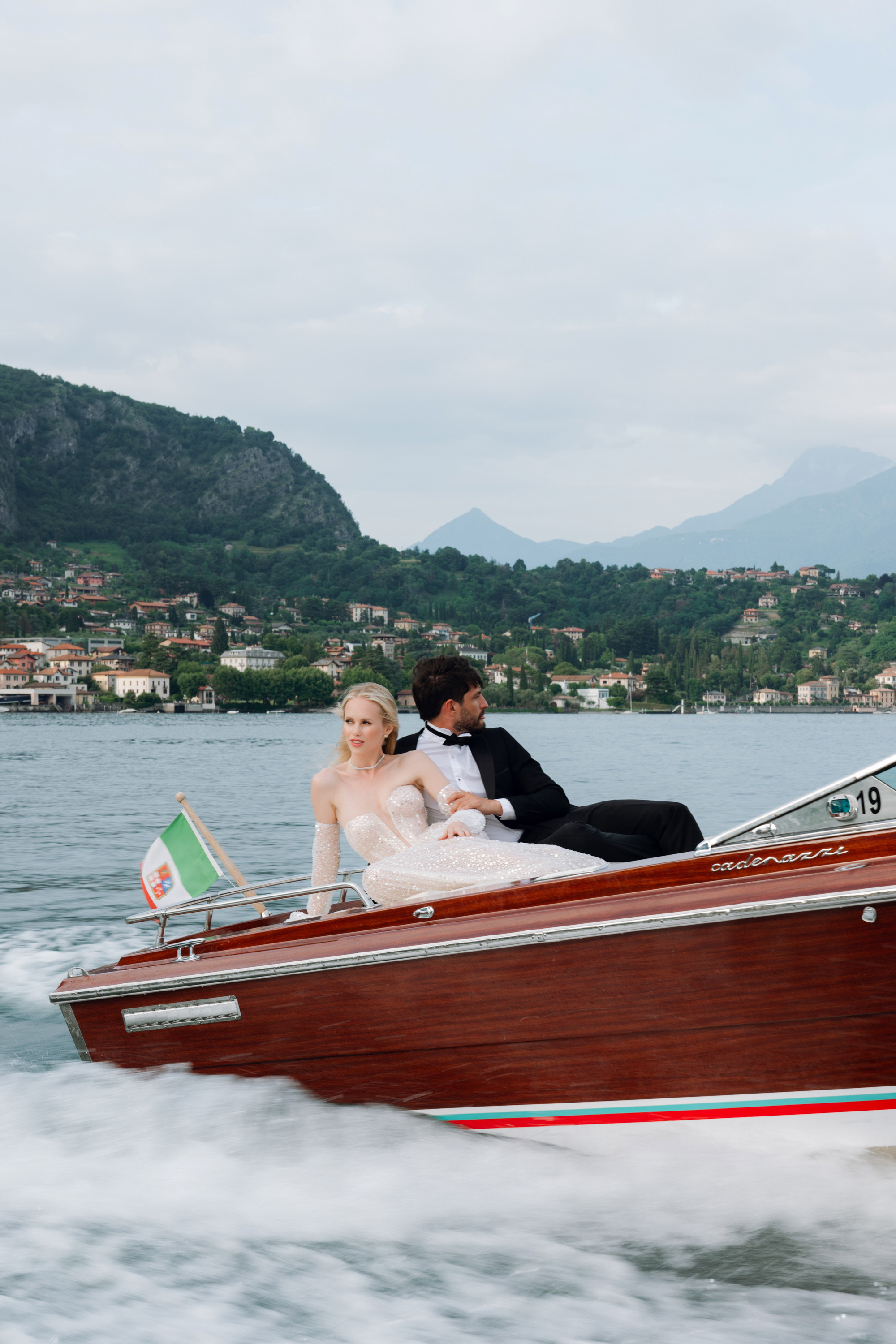 a bride and groom in a boat